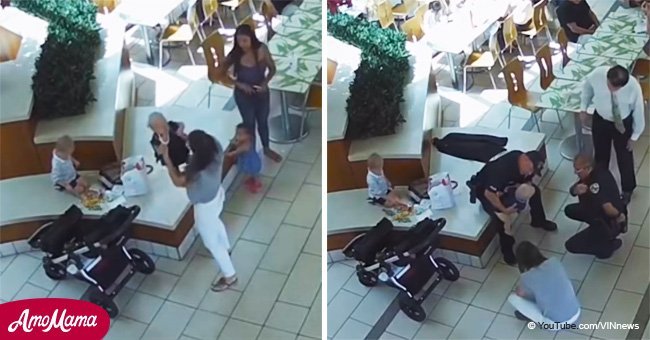 Police rush to help choking baby while mother looks on helplessly