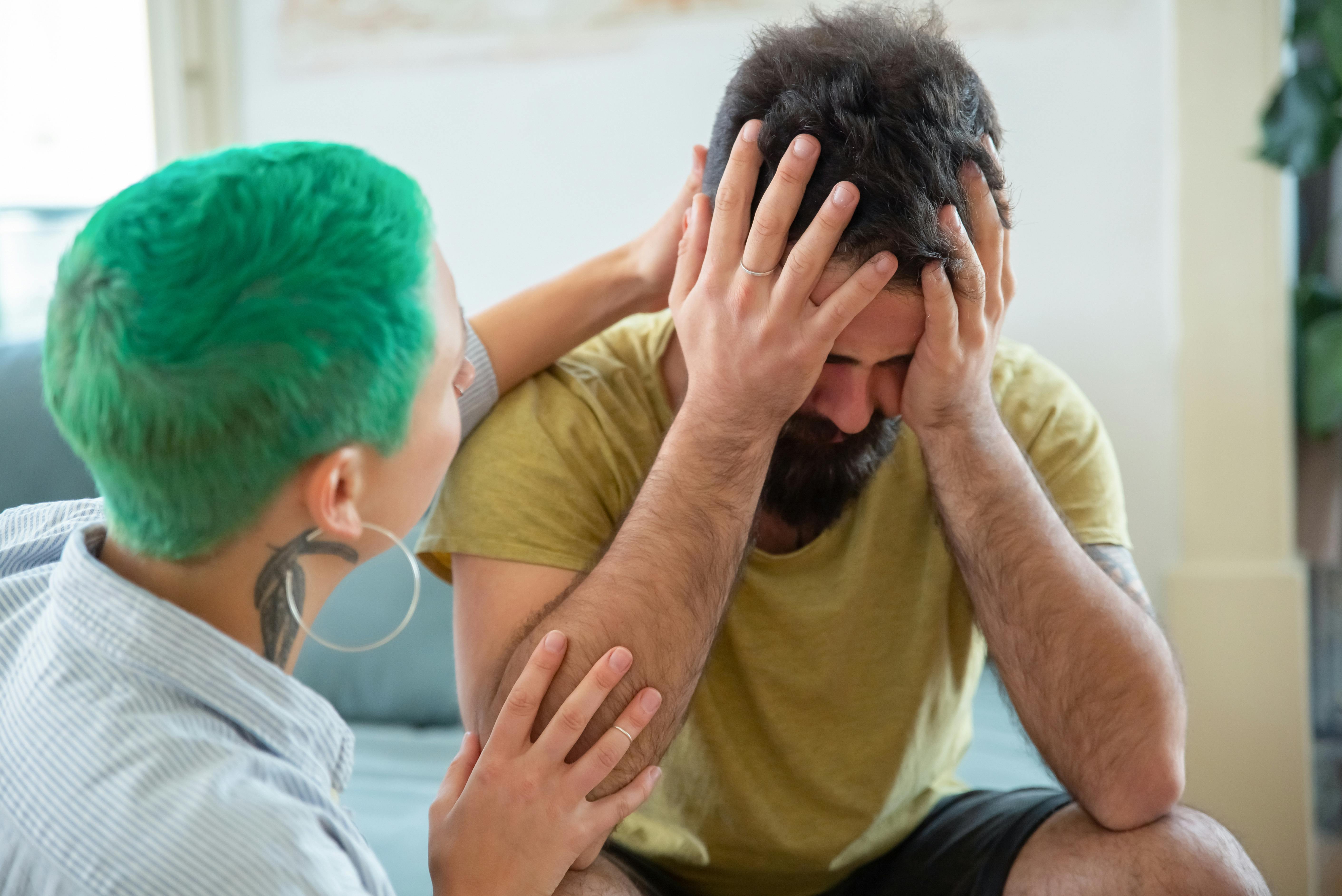 A woman comforting an upset man | Source: Pexels