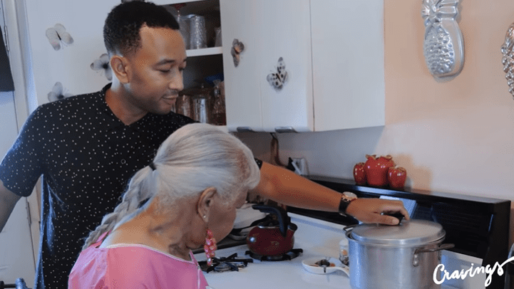 John Legend helos his grandmither Marjorie to cook green collards | Source: YouTube/Chrissy Teigen
