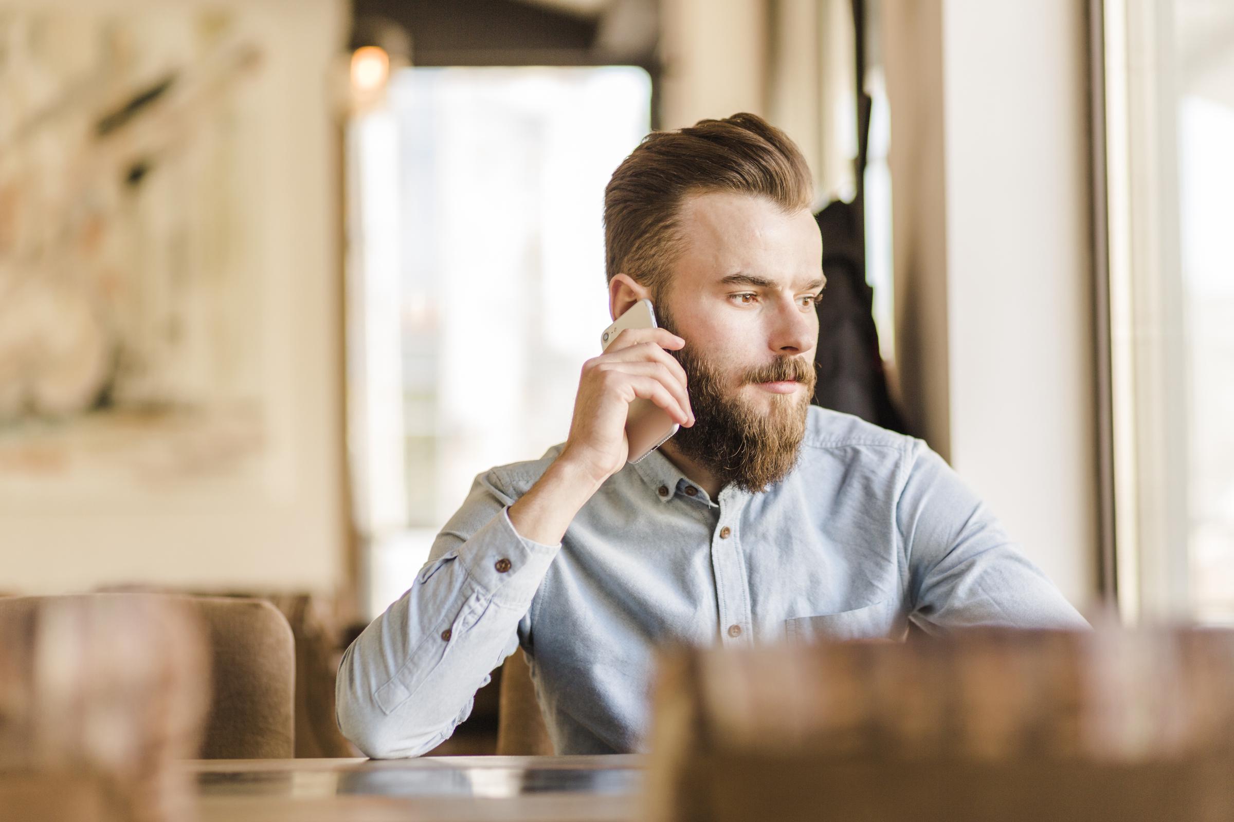 A man on a phone call | Source: Freepik