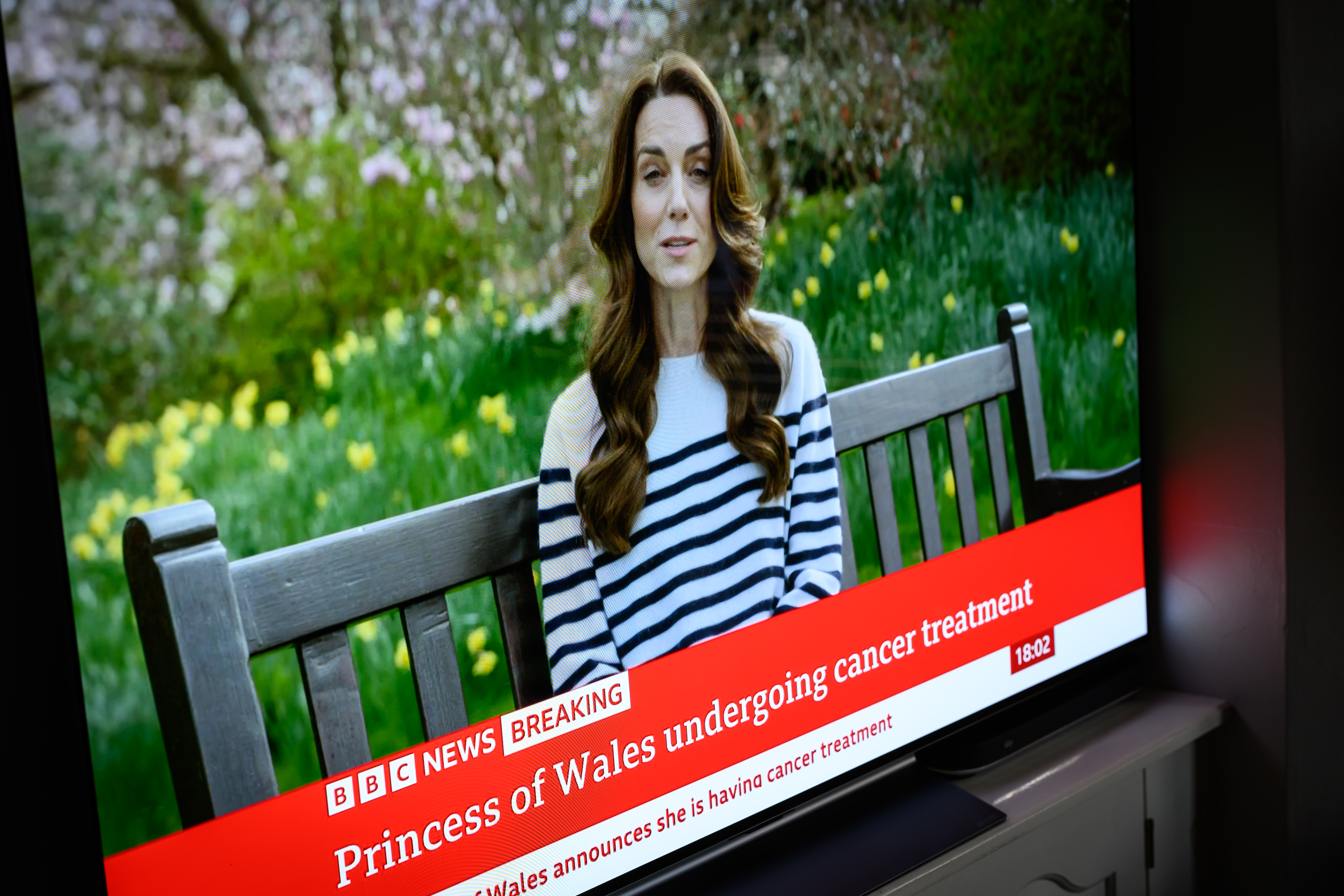 A screen displays a news report, as Catherine, The Princess of Wales announces that she is receiving a preventative course of chemotherapy for cancer in London, England, on March 22, 2024 . | Source: Getty Images