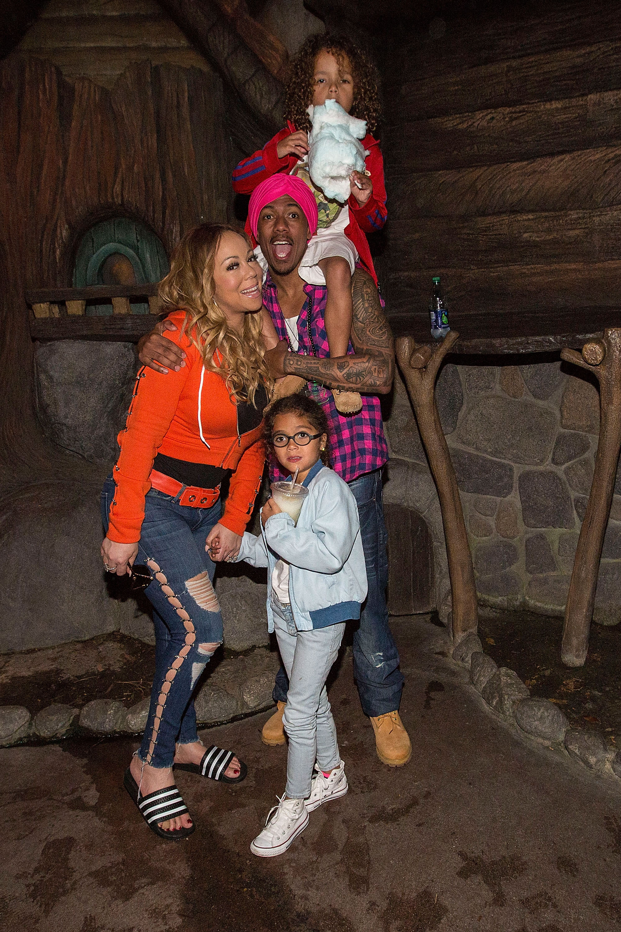 Mariah Carey and Nick Cannon prepare to ride Splash Mountain at Disneyland with their twins, Moroccan Scott Cannon and Monroe Cannon, on April 30, 2017, in Anaheim, California. The family visited the theme park to celebrate the twins' sixth birthday.