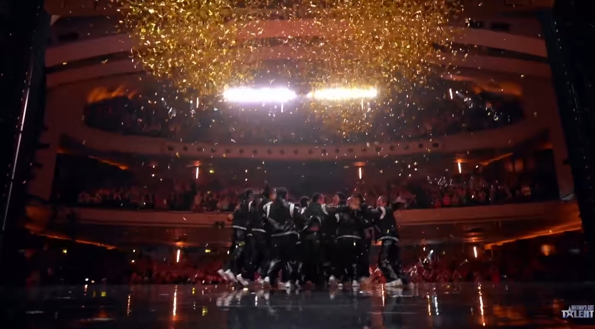 Golden confetti rains down on the performers as they celebrate their Golden Buzzer moment on stage. | Source: YouTube/Britain's Got Talent