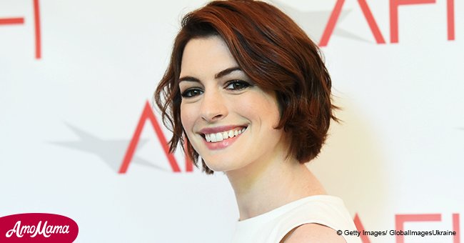 Anne Hathaway showcases her flawless complexion while sporting a make-up free look