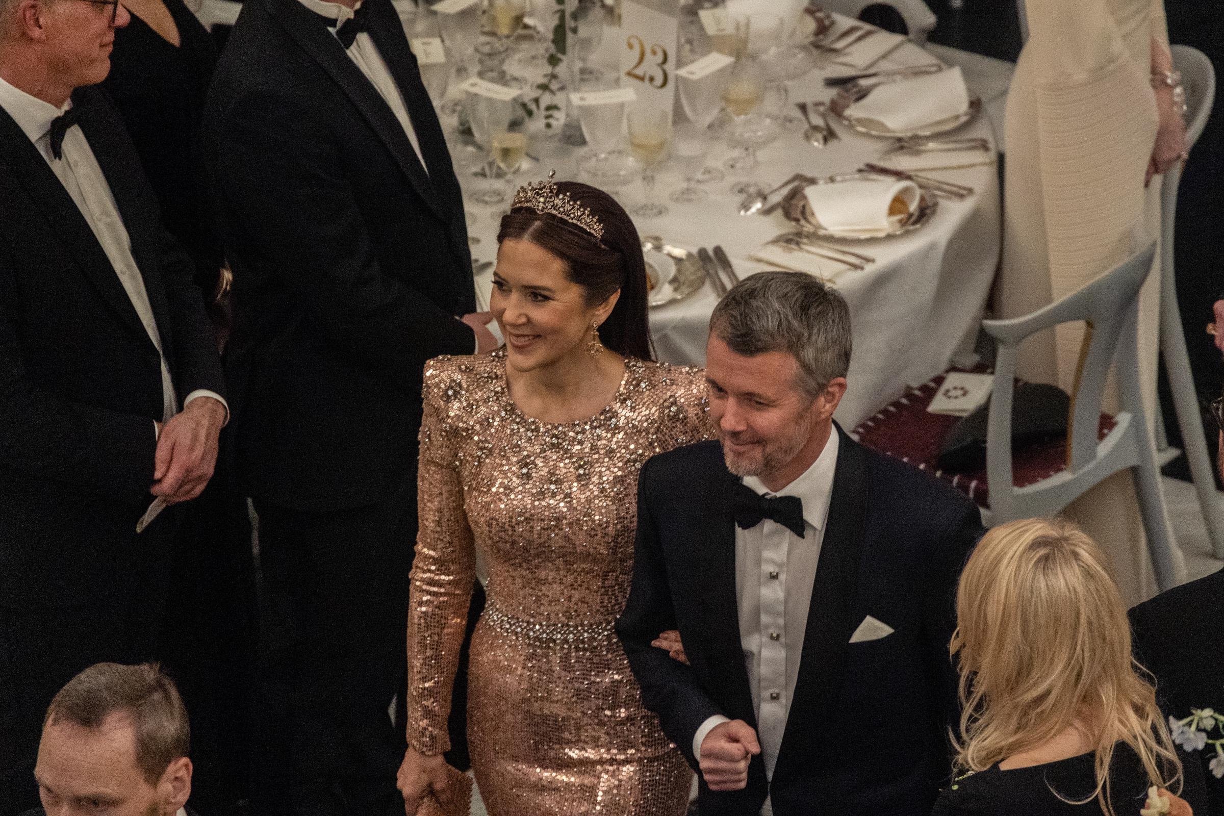 Queen Mary and King Frederik X arrive at an evening party for representatives from the world of arts and culture. Queen Mary dazzles in the same Jenny Packham gown first worn by Catherine, Princess of Wales, at the 2023 Diplomatic Corps reception.