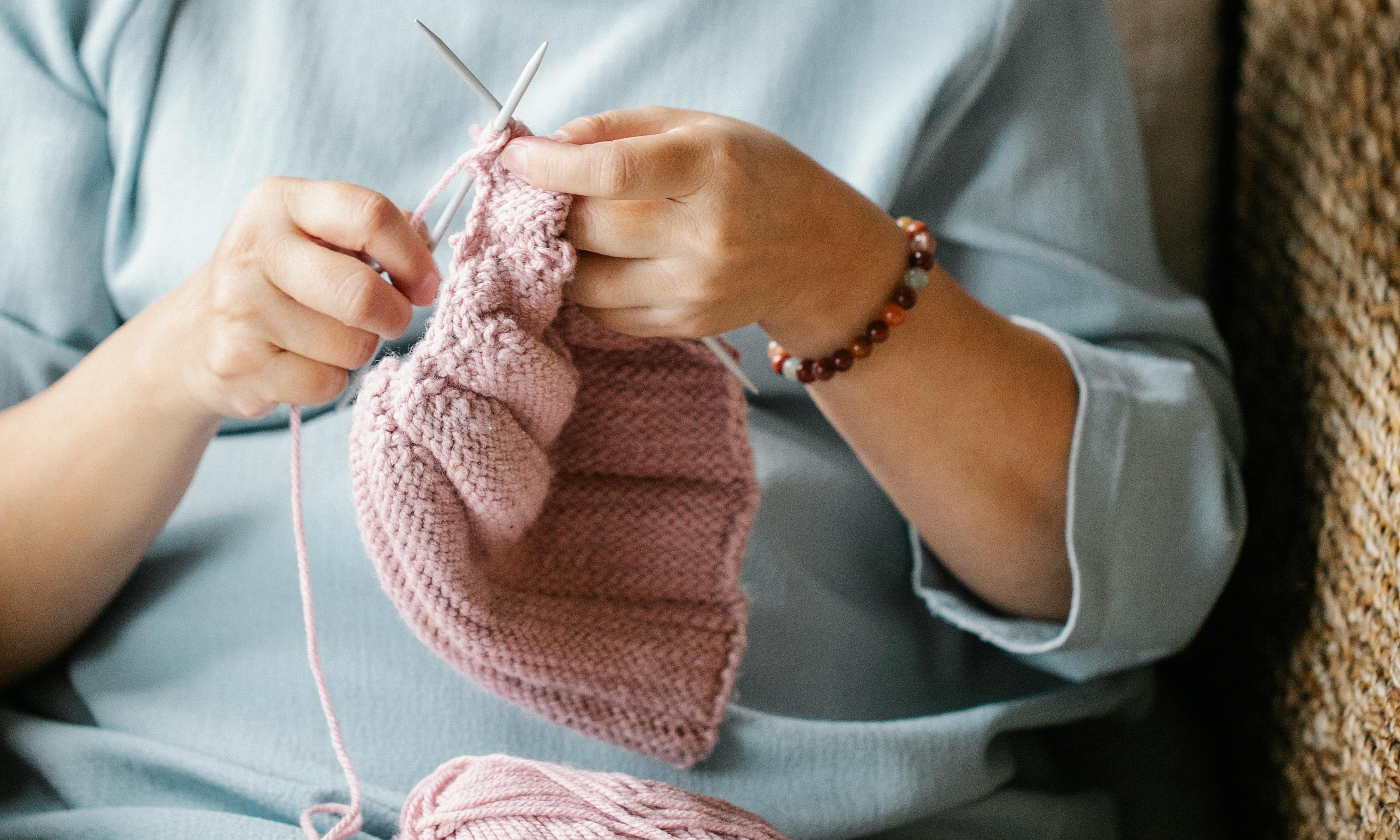 Gran knitting by the window | Source: Pexels