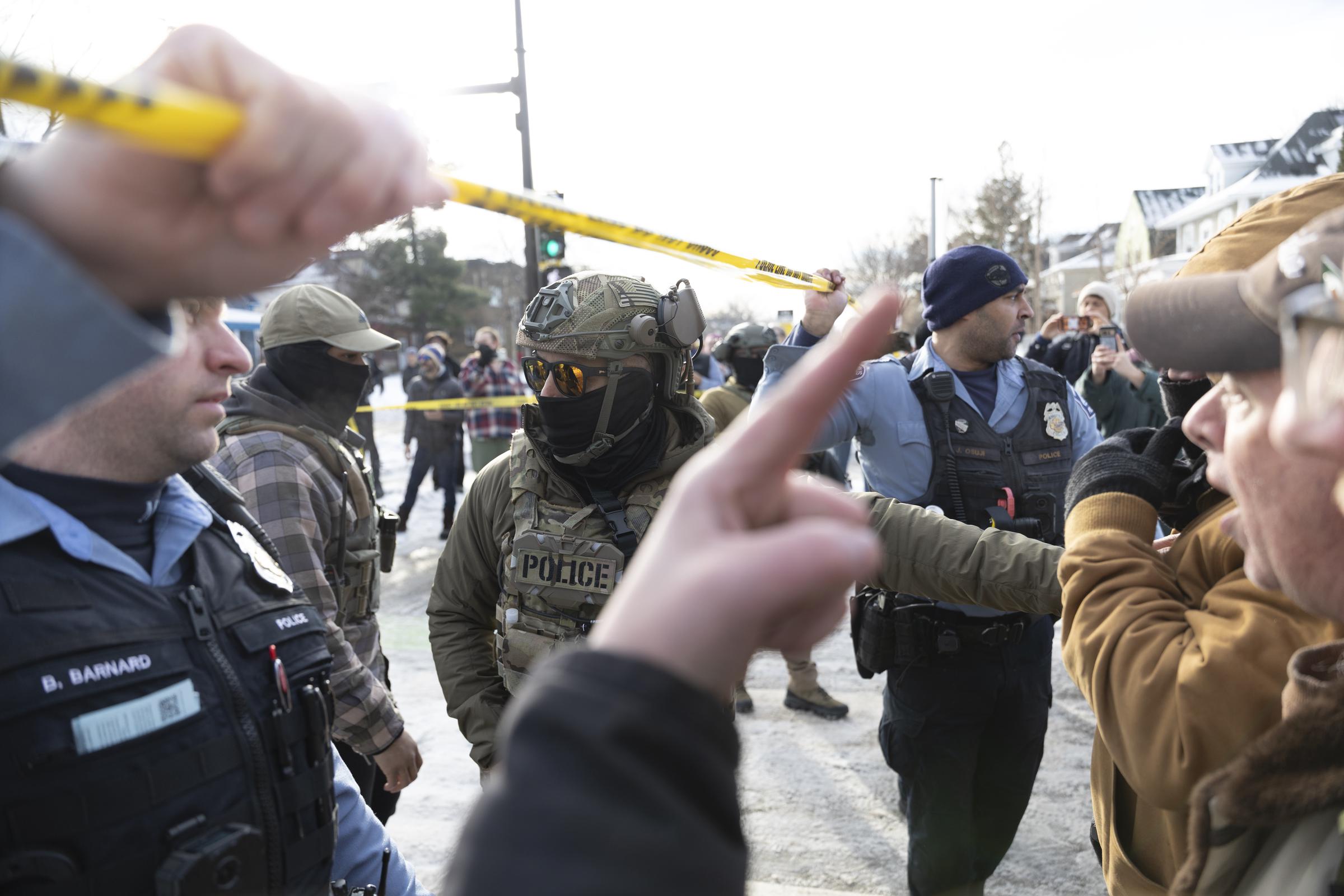 Protesters confront law enforcement at the scene following the ICE-involved shooting in Minneapolis | Source: Getty Images