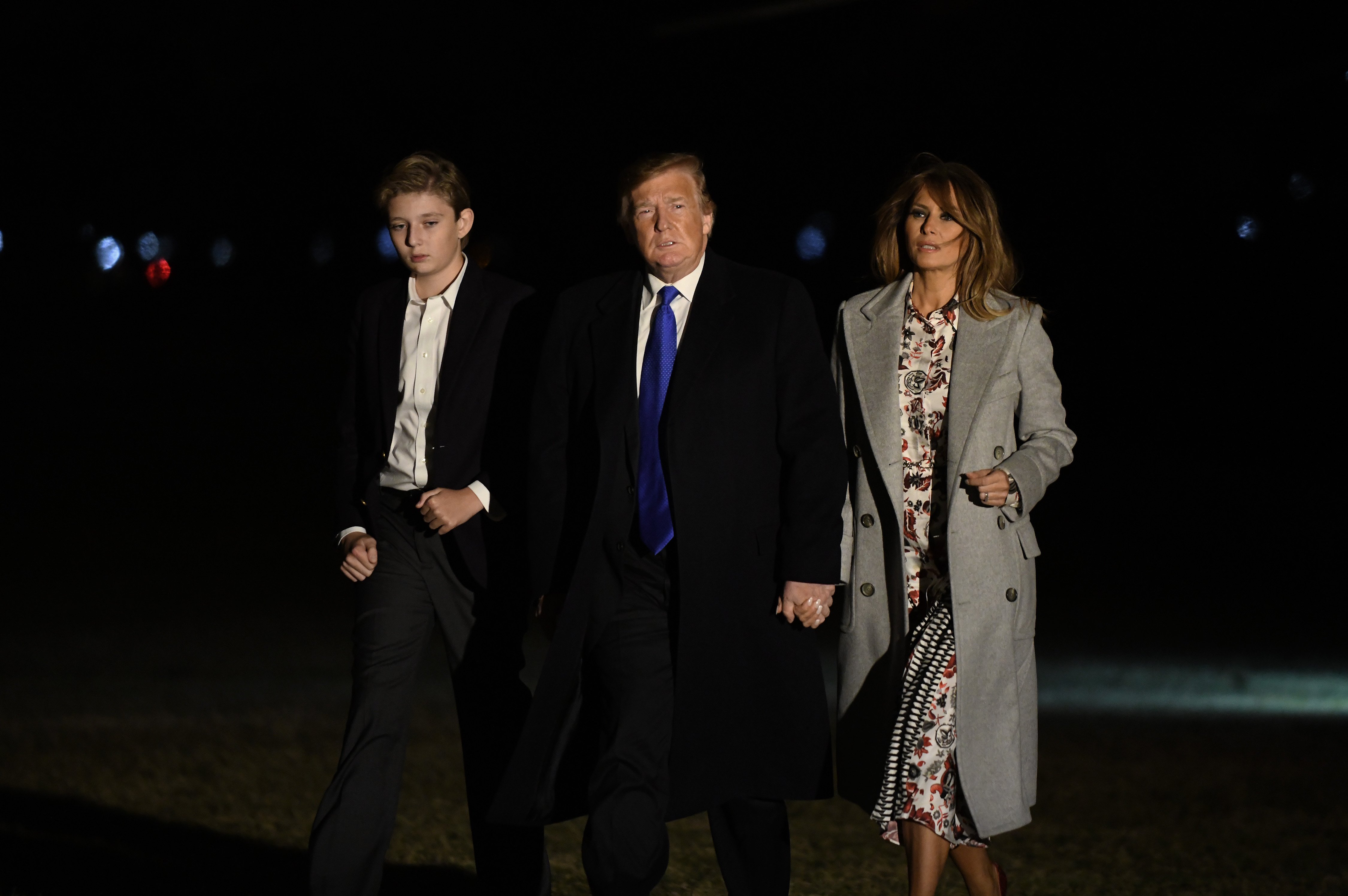 President Donald Trump and First Lady Melania with their son Baron on the grounds of the White House | Photo: Getty Images