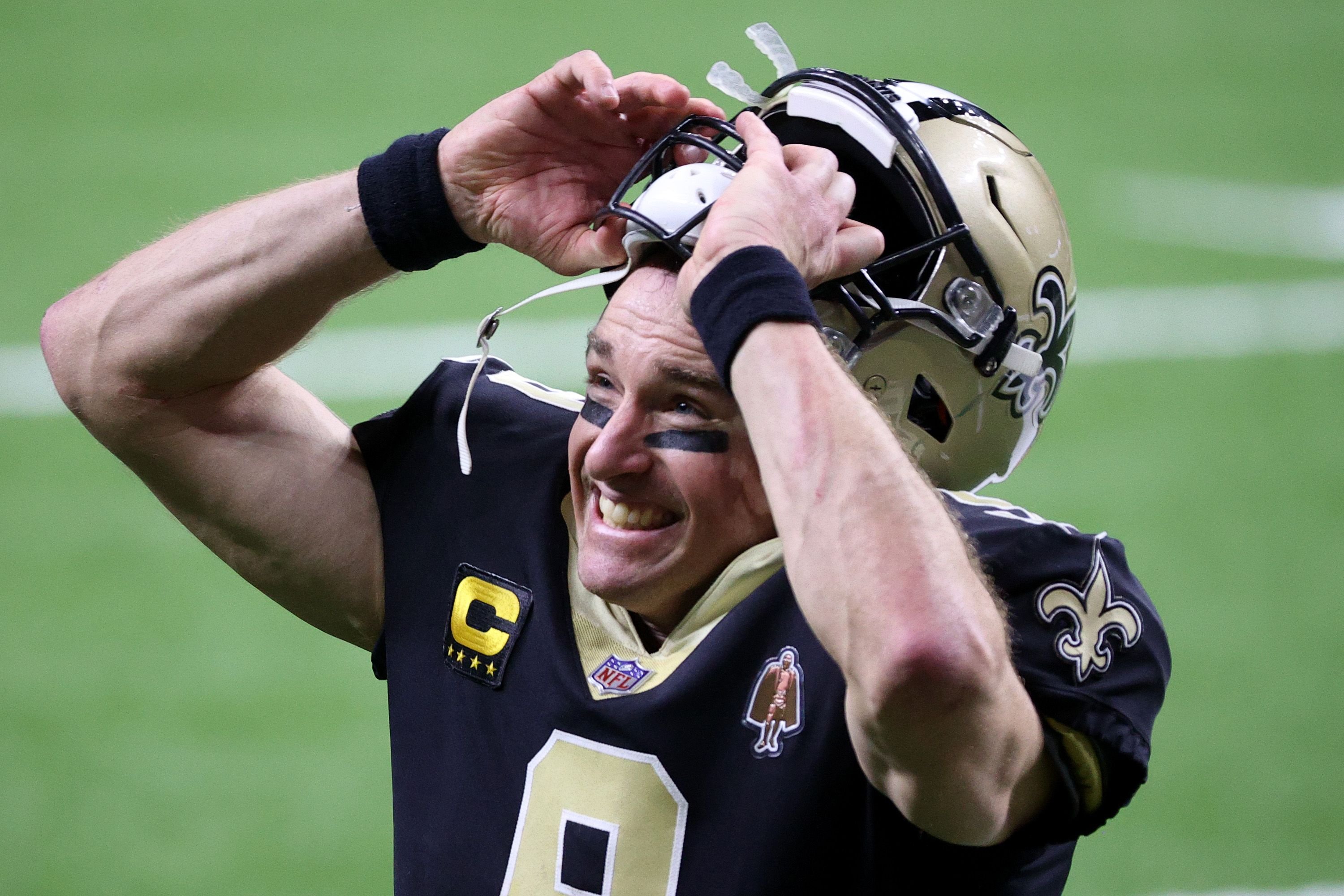 Drew Brees #9 of the New Orleans Saints celebrates after defeating the Chicago Bears with a score of 21 to 9 in the NFC Wild Card Playoff game at Mercedes Benz Superdome on January 10, 2021 | Photo: Getty Images