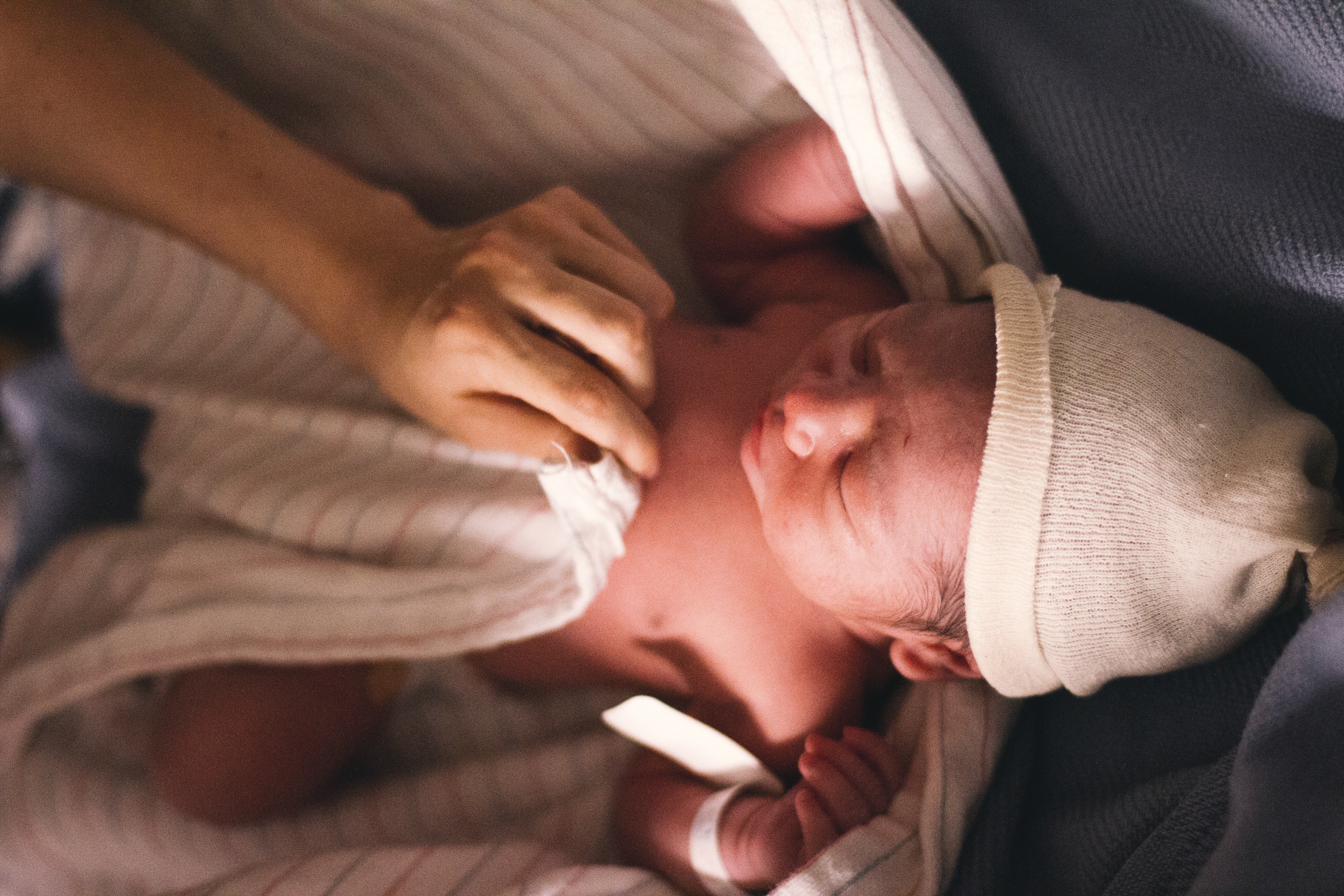 Newborn baby being wrapped. | Source: Isaac Taylor/Pexels