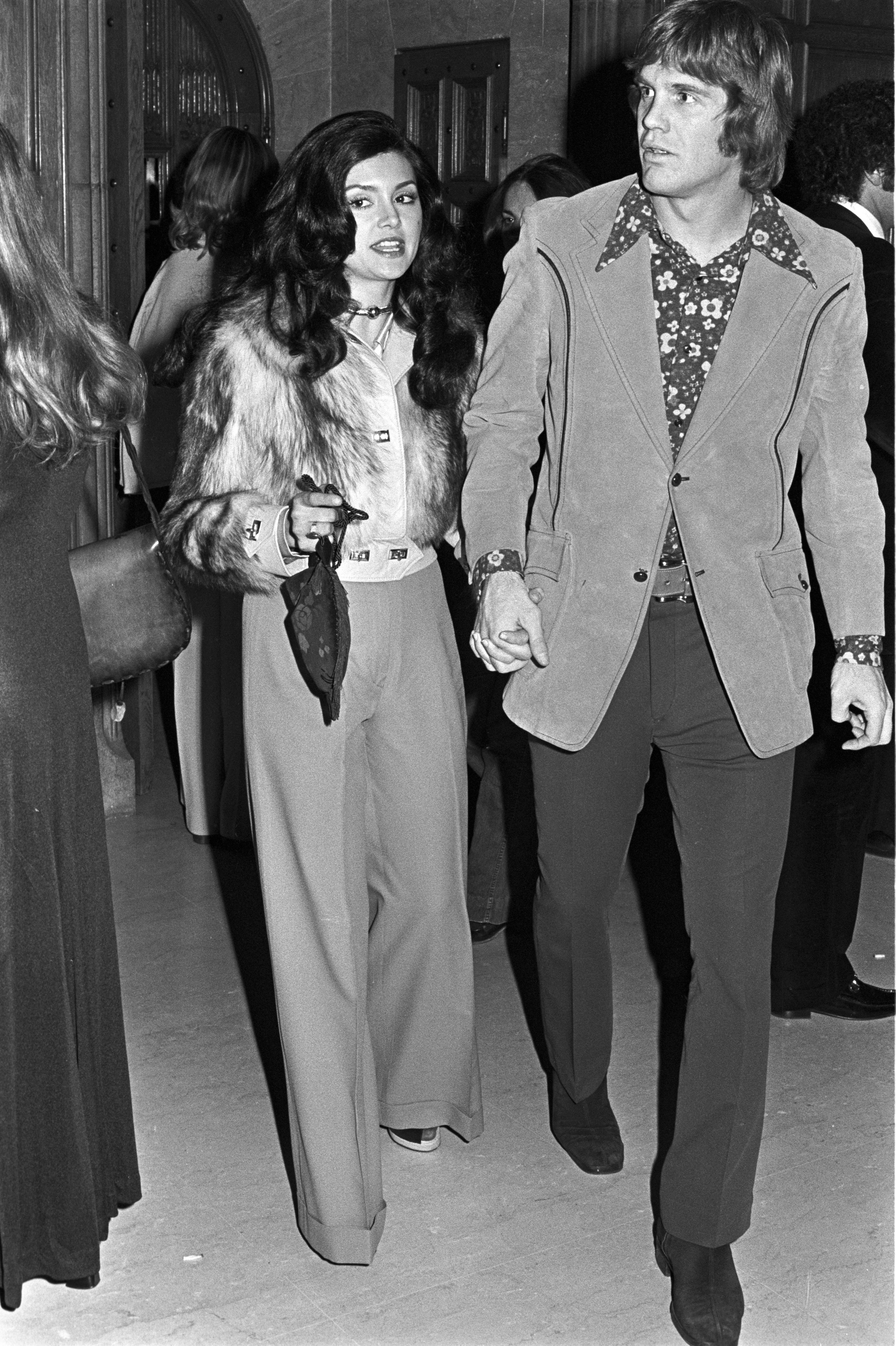 Victoria Principal and Lance Rentzel at a party thrown by Hugh Hefner at The Playboy Mansion in an undated photo | Source: Getty Images