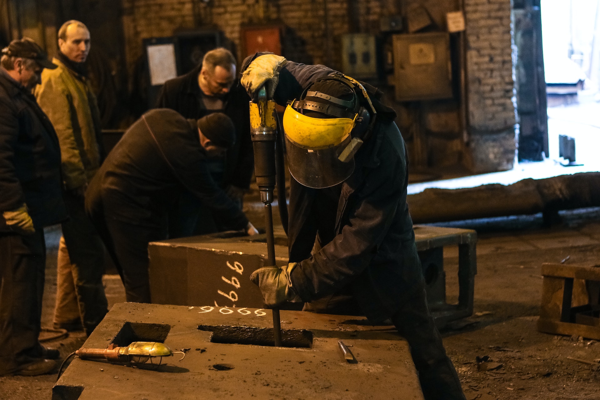 Men working in a factory | Source: Pexels