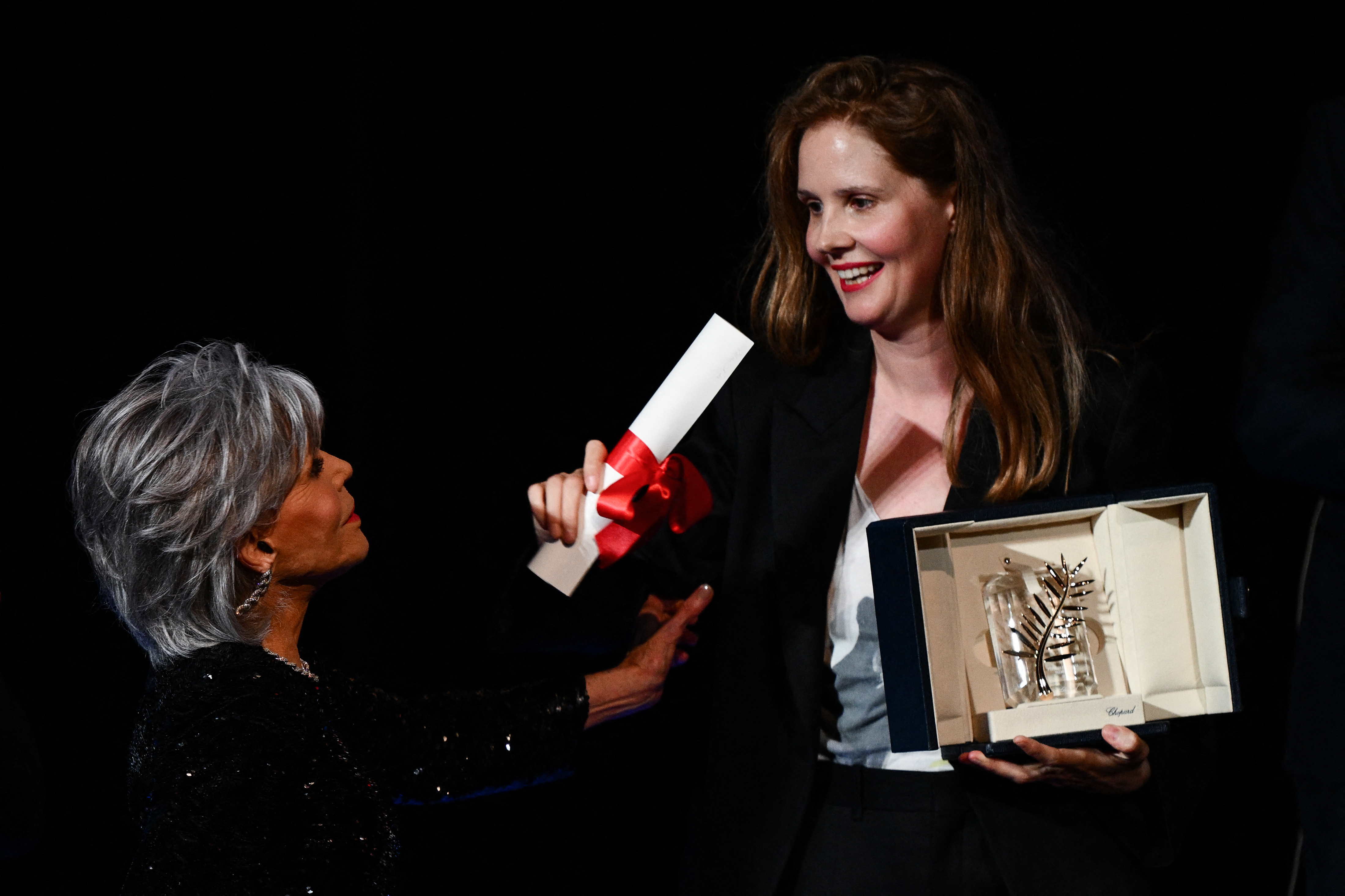 Jane Fonda on stage with Justine Triet as she receives the Palme d'Or Award for "Anatomy of a Fall" during the 76th annual Cannes Film Festival at Palais des Festivals on May 27, 2023 in Cannes, France | Source: Getty Images