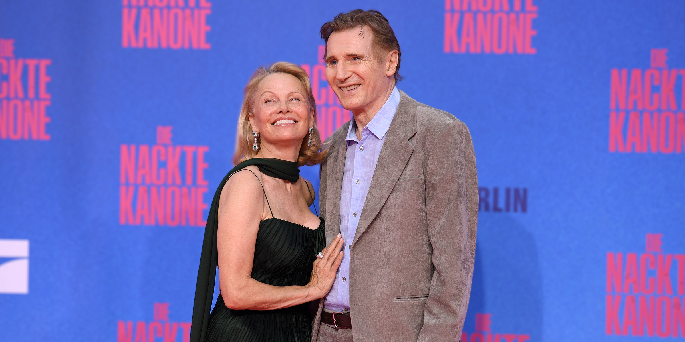 Pamela Anderson and Liam Neeson | Source: Getty Images