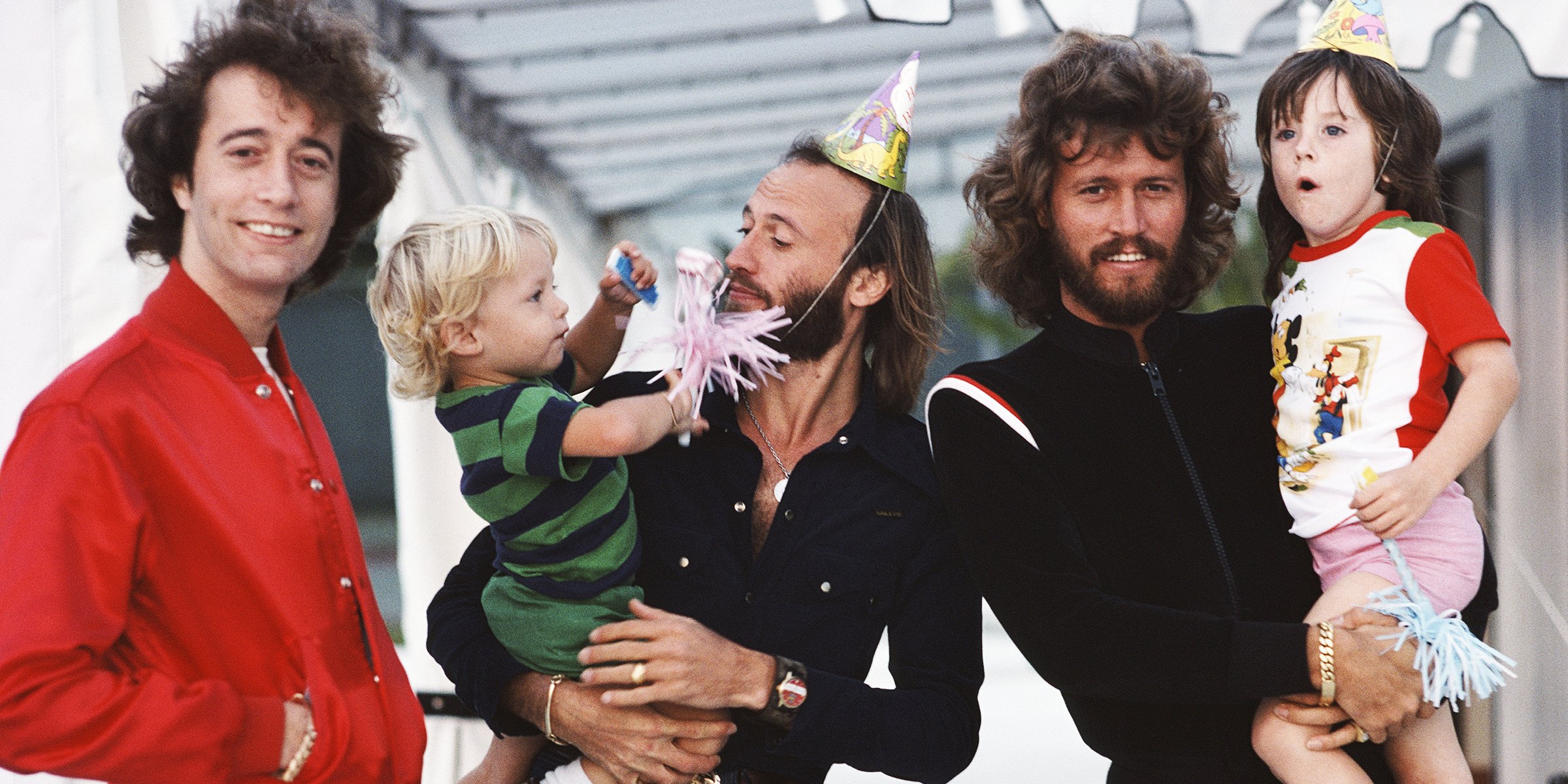 The Bee Gees - Barry Gibb, Maurice Gibb and Robin Gibb with two of their kids | Source: Getty Images