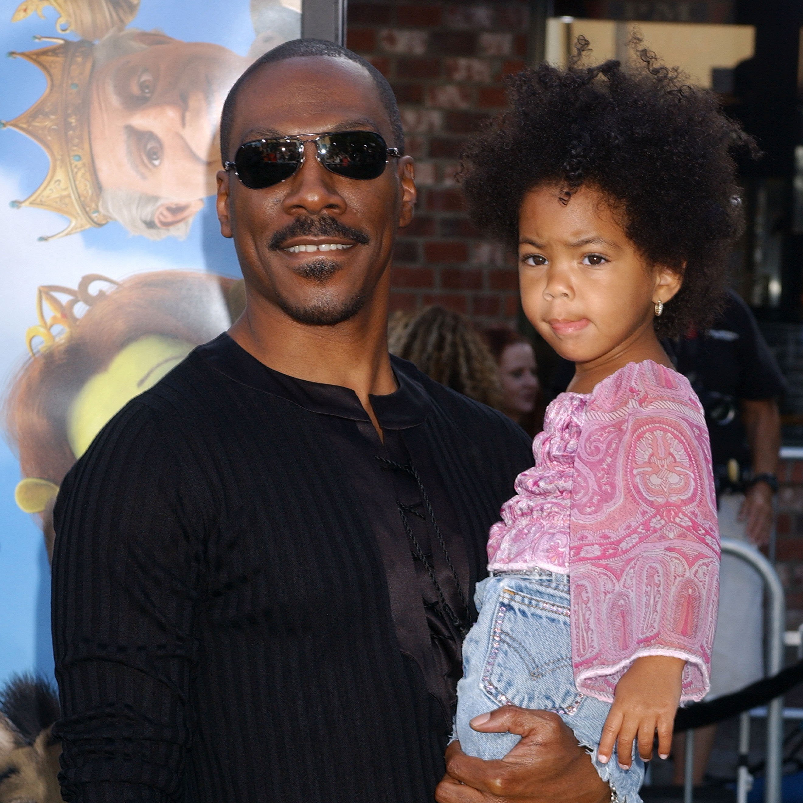 Eddie Murphy and his daughter during the "Shrek 2" - Los Angeles premiere in Westwood, California, on May 8, 2004. | Source: Getty Images