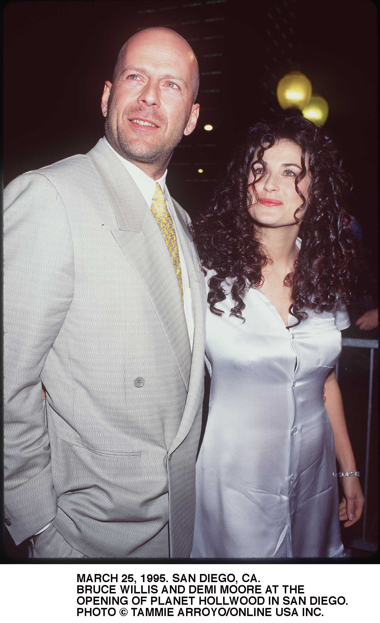 Actors Bruce Willis and his wife Demi Moore during the opening of Planet Hollywood on March 25, 1995 in San Diego, California ┃ Source: Getty Images