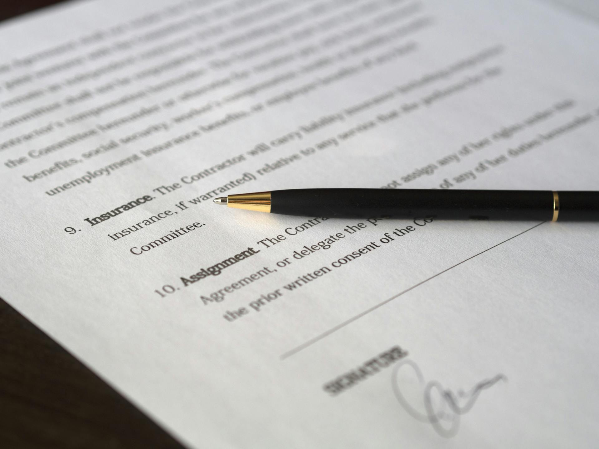 A black pen placed on an important document | Source: Pexels