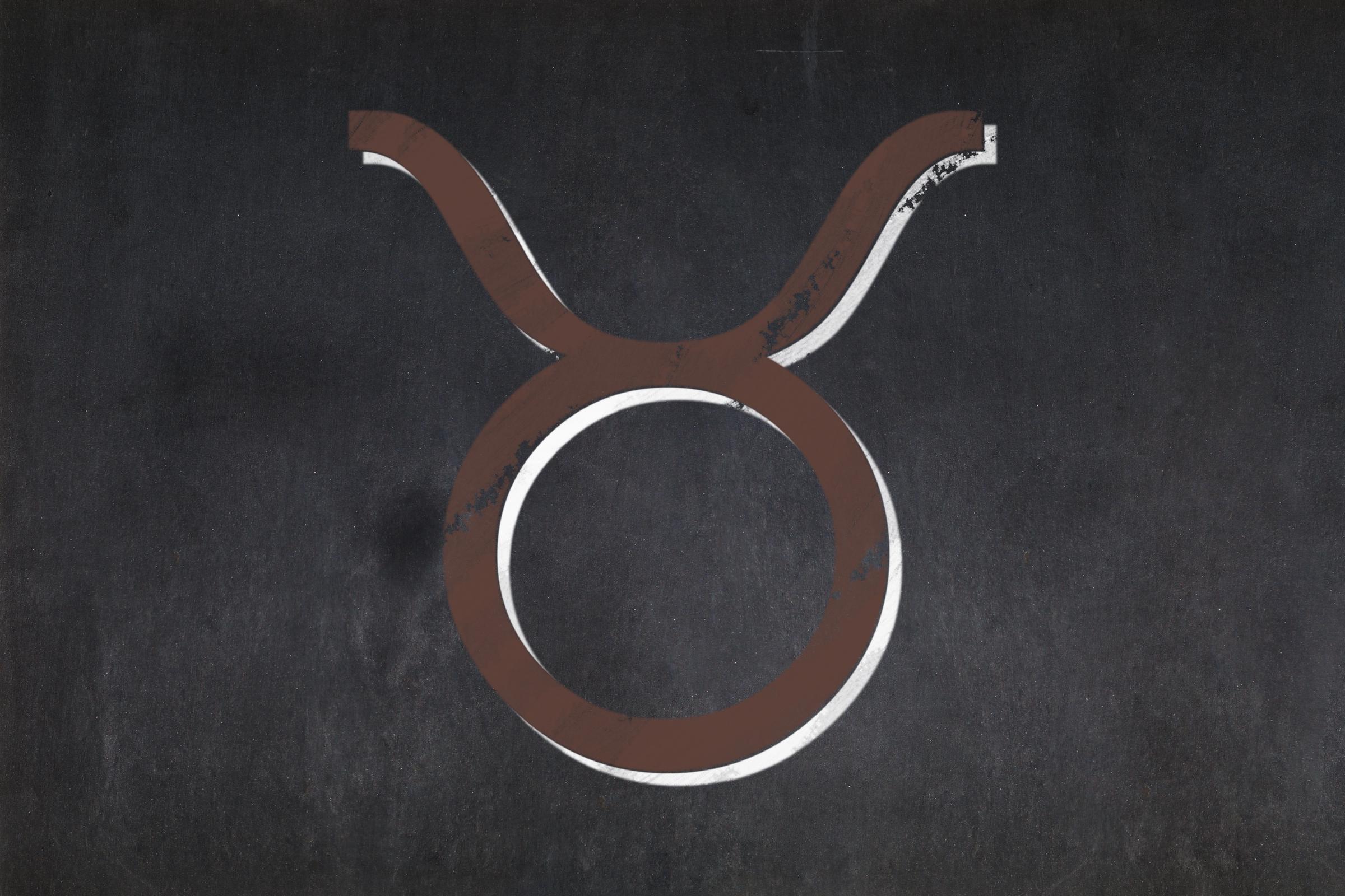 Blackboard with zodiac sign "Taurus" drawn in the middle | Source: Shutterstock