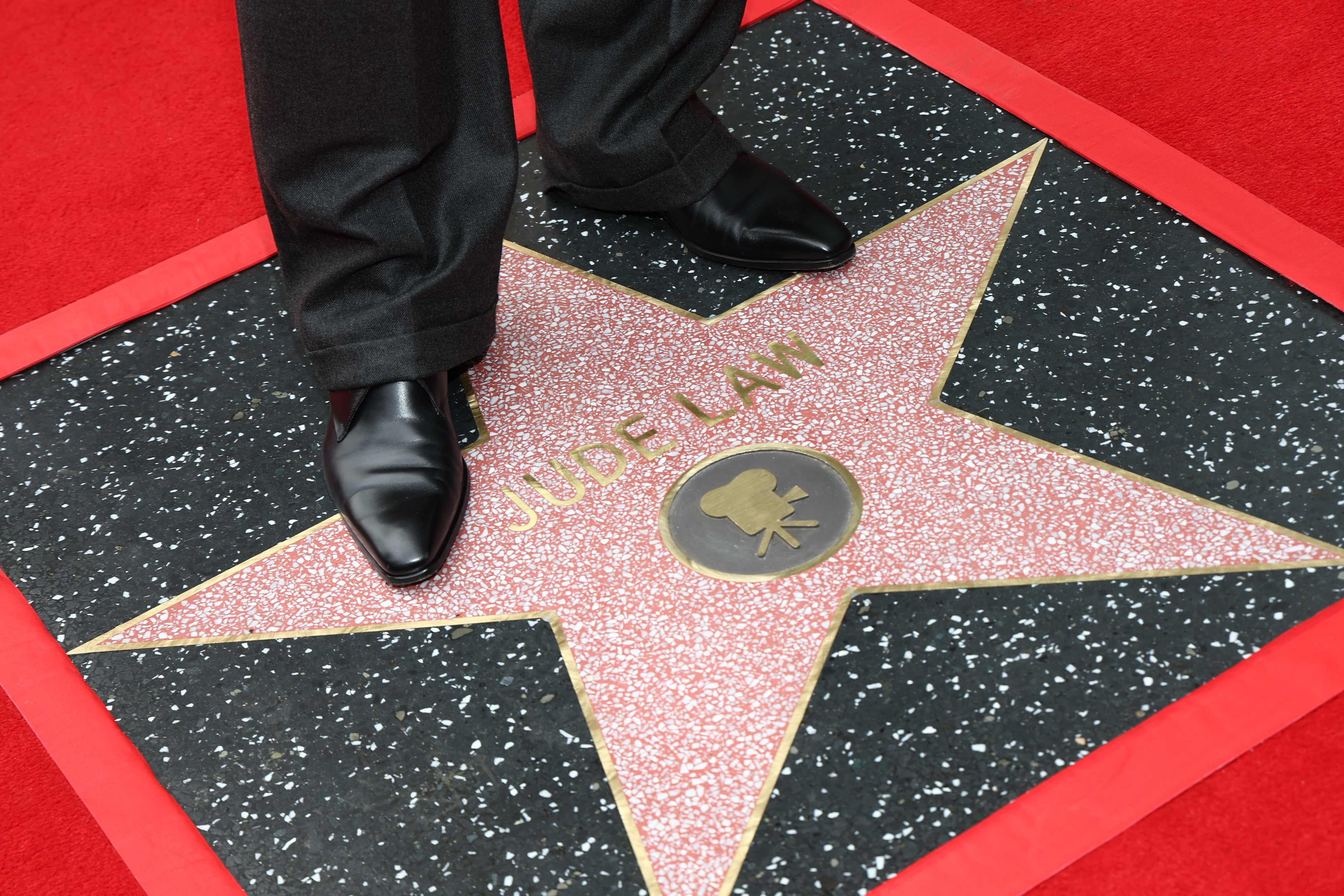 Jude Law, star detail, attends his Hollywood Walk of Fame Star Ceremony on December 12, 2024 | Source: Getty Images