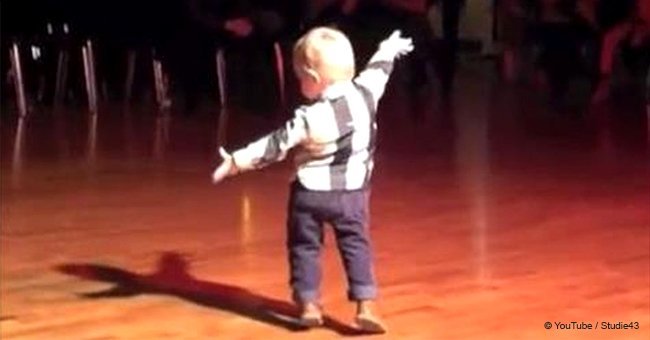 Boy hears favorite Elvis Presley hit and steals the spotlight the instant he starts to move