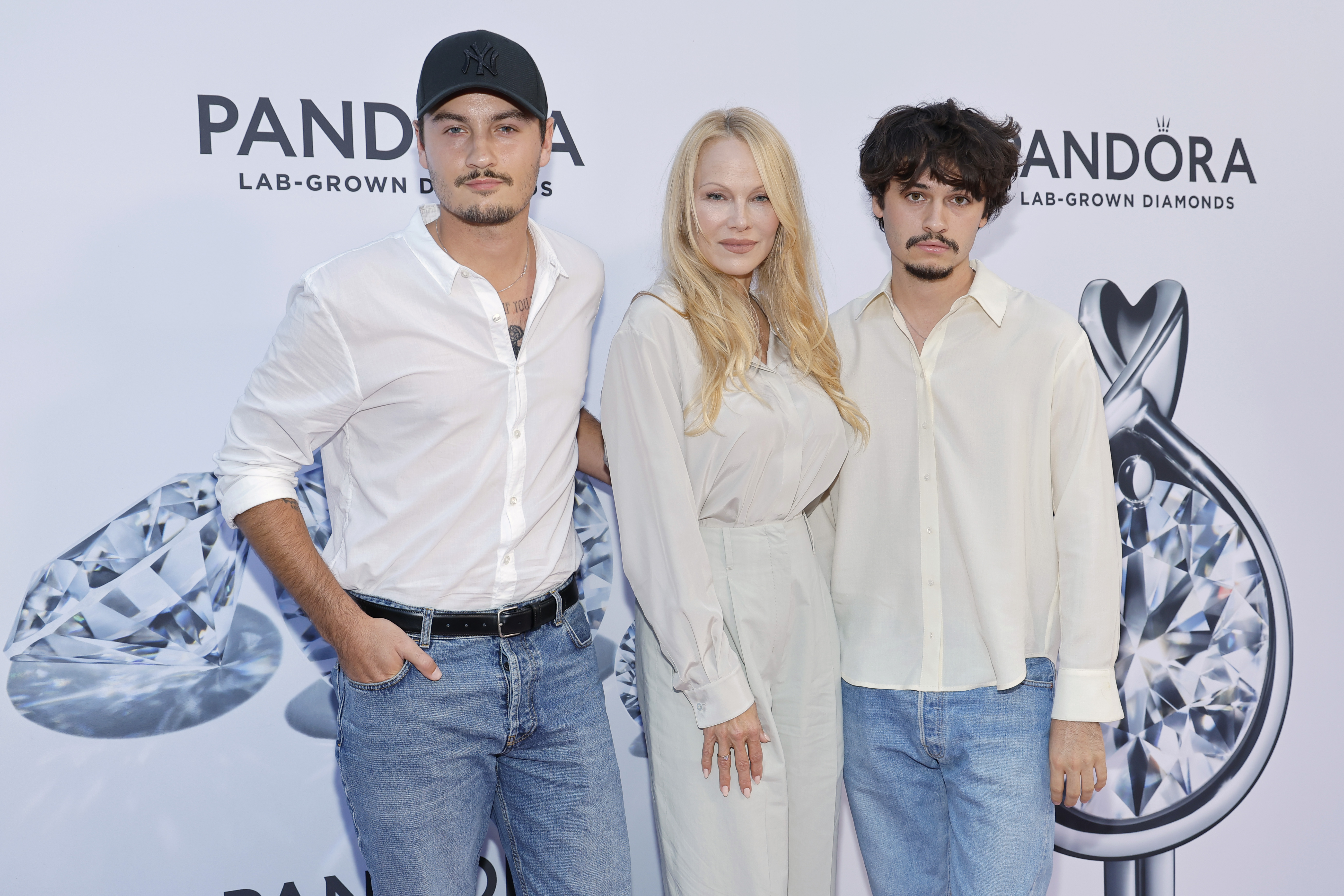 Brandon Lee, Pamela Anderson, Dylan Lee at Pandora Celebrates Lab Grown Diamonds With A New Diamond District in New York City on September 6, 2023. | Source: Getty Images