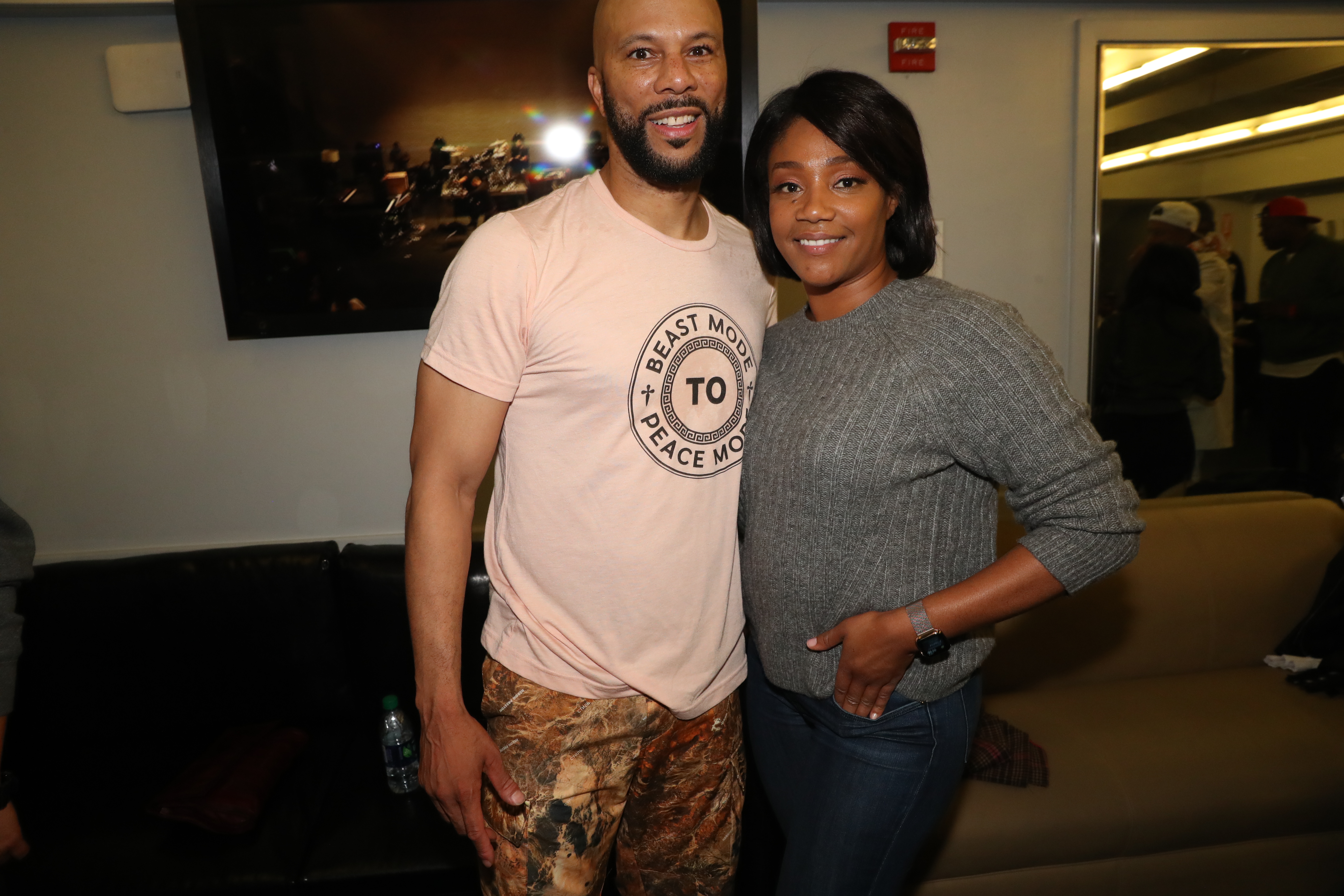 Common and Tiffany Haddish at one of his concerts at The Apollo Theater in New York City, 2019 | Source: Getty Images