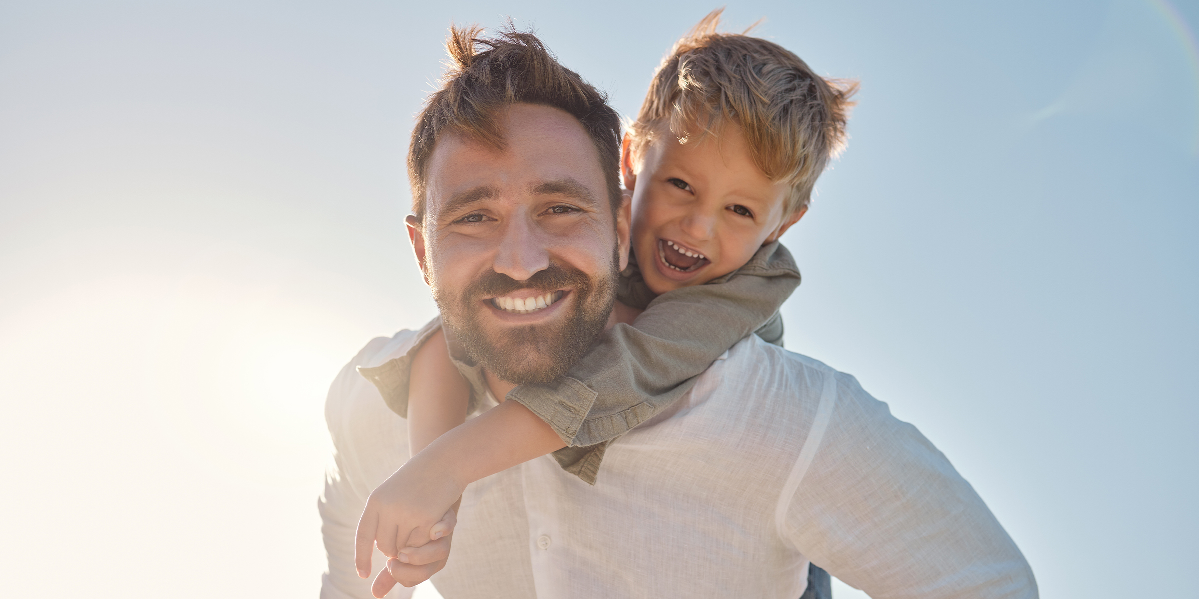 A boy and his father | Source: Shutterstock