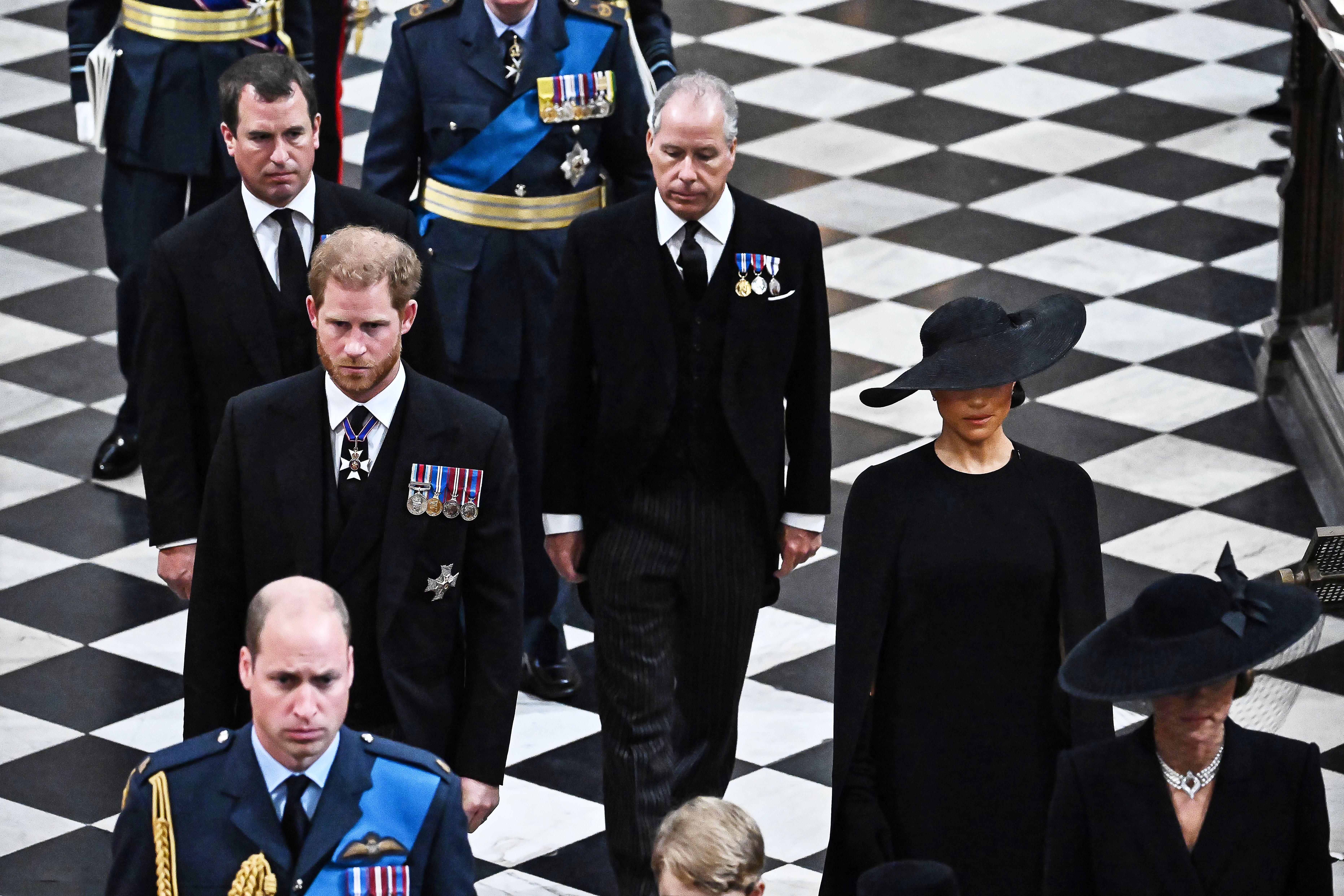 Peter Phillips, Prince Harry, Duke of Sussex, Prince William, Prince of Wales, Earl of Snowdon, and Meghan, Duchess of Sussex leave the Abbey at the State Funeral Service for Britain's Queen Elizabeth II at Westminster Abbey on September 19, 2022, in London, England. | Source: Getty Images