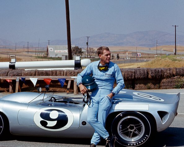 Steve McQueen (1930 - 1980), in Firestone racing suit, at Riverside Raceway, California, July 1966 | Photo: Getty Images