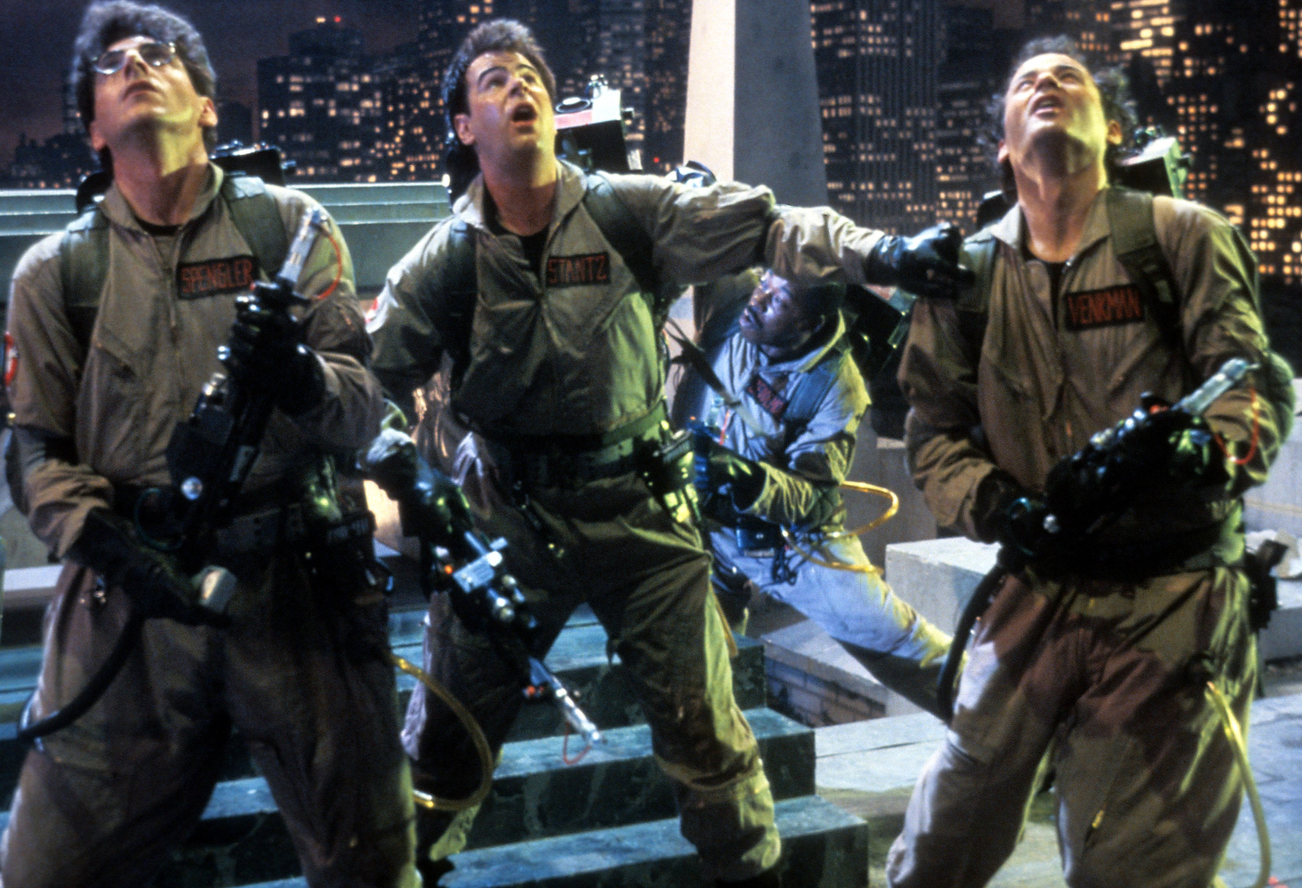 Harold Ramis, Dan Aykroyd, Ernie Hudson (background), and Bill Murray in a scene from the film 'Ghostbusters', directed by Ivan Reitman in 1984 | Source: Getty Images 