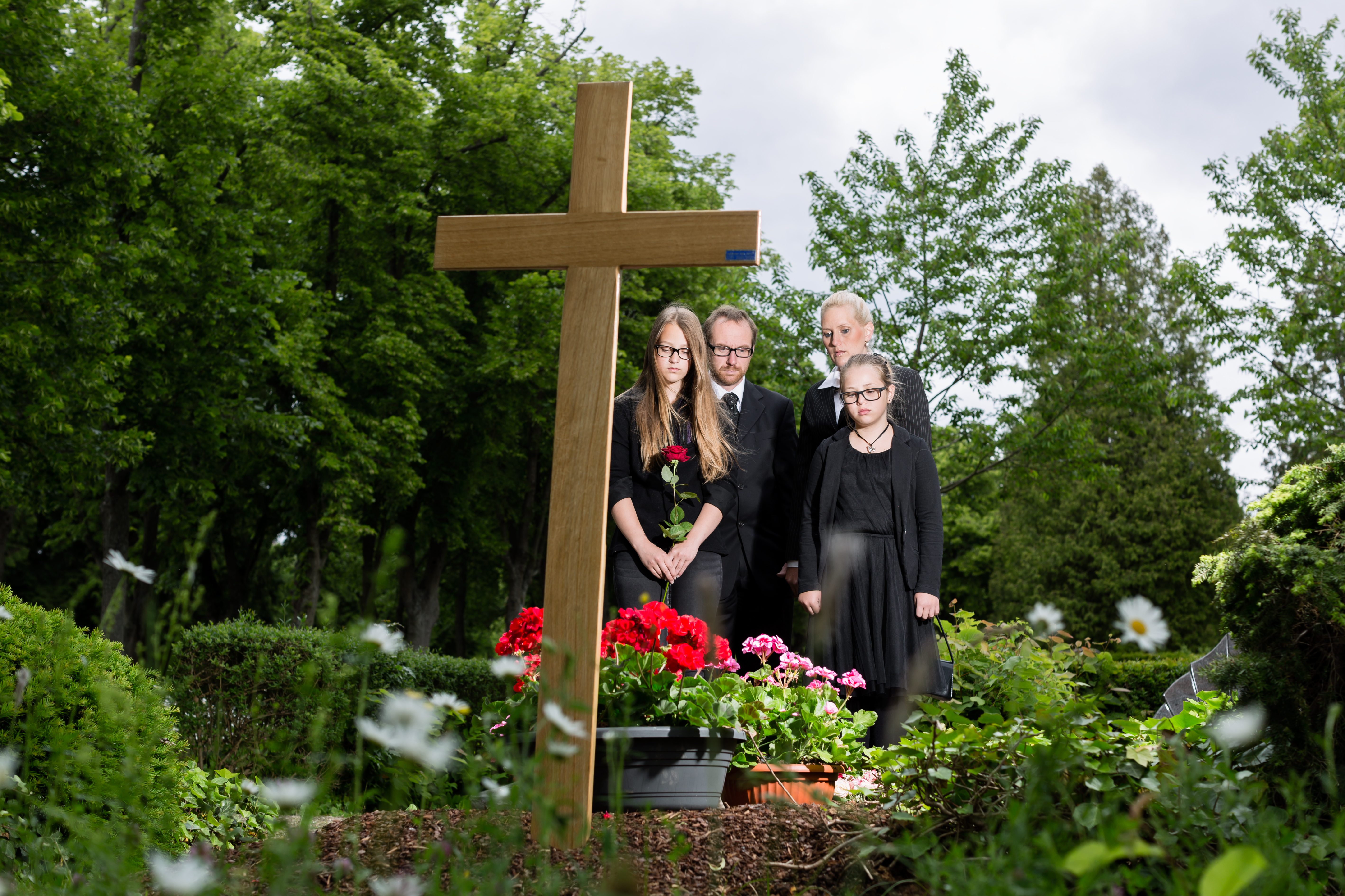 A family at a funeral | Source: Shutterstock