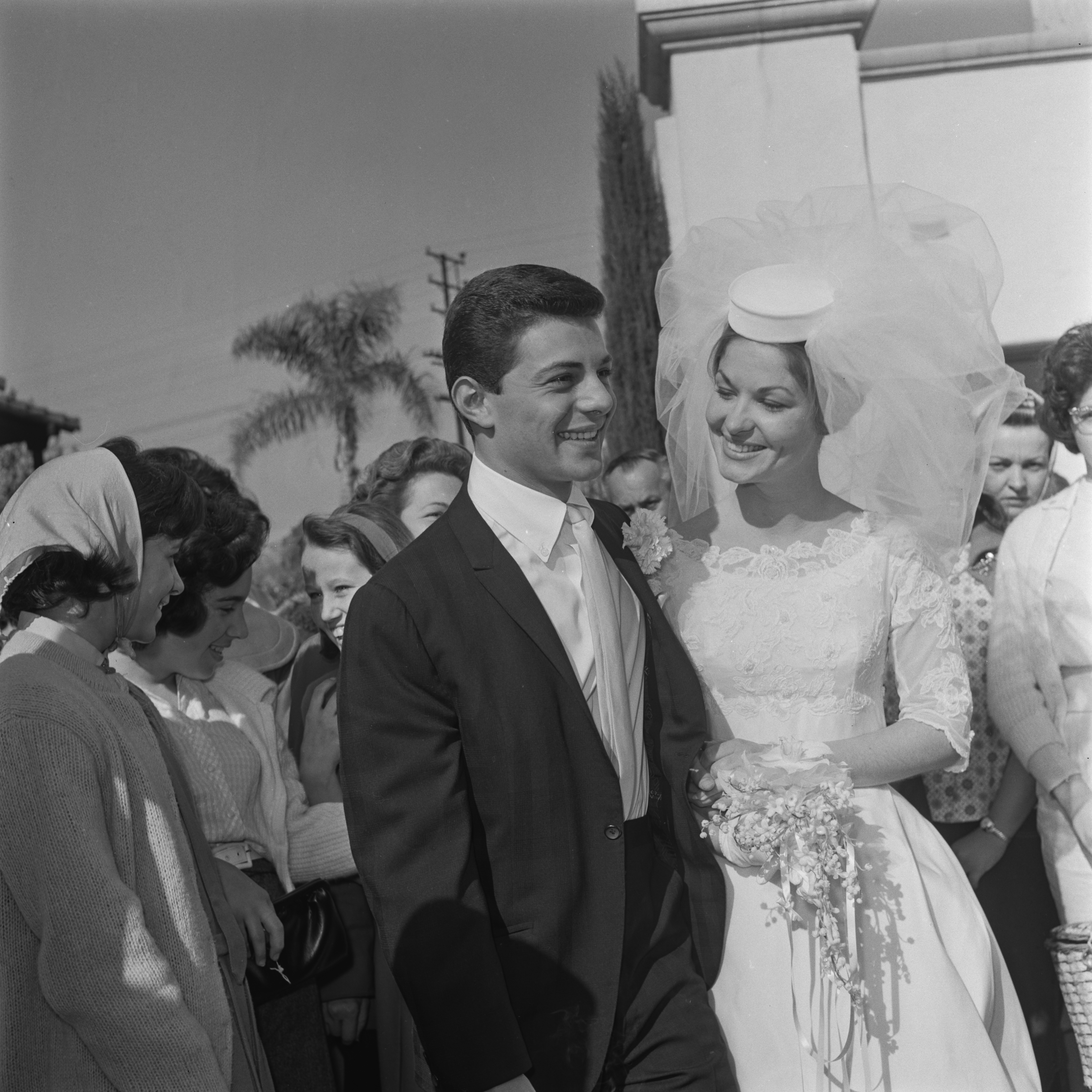 American actor and singer Frankie Avalon with his bride Kathryn 'Kay' Diebel after their wedding in North Hollywood, California on January 19, 1963. | Source: Getty Images