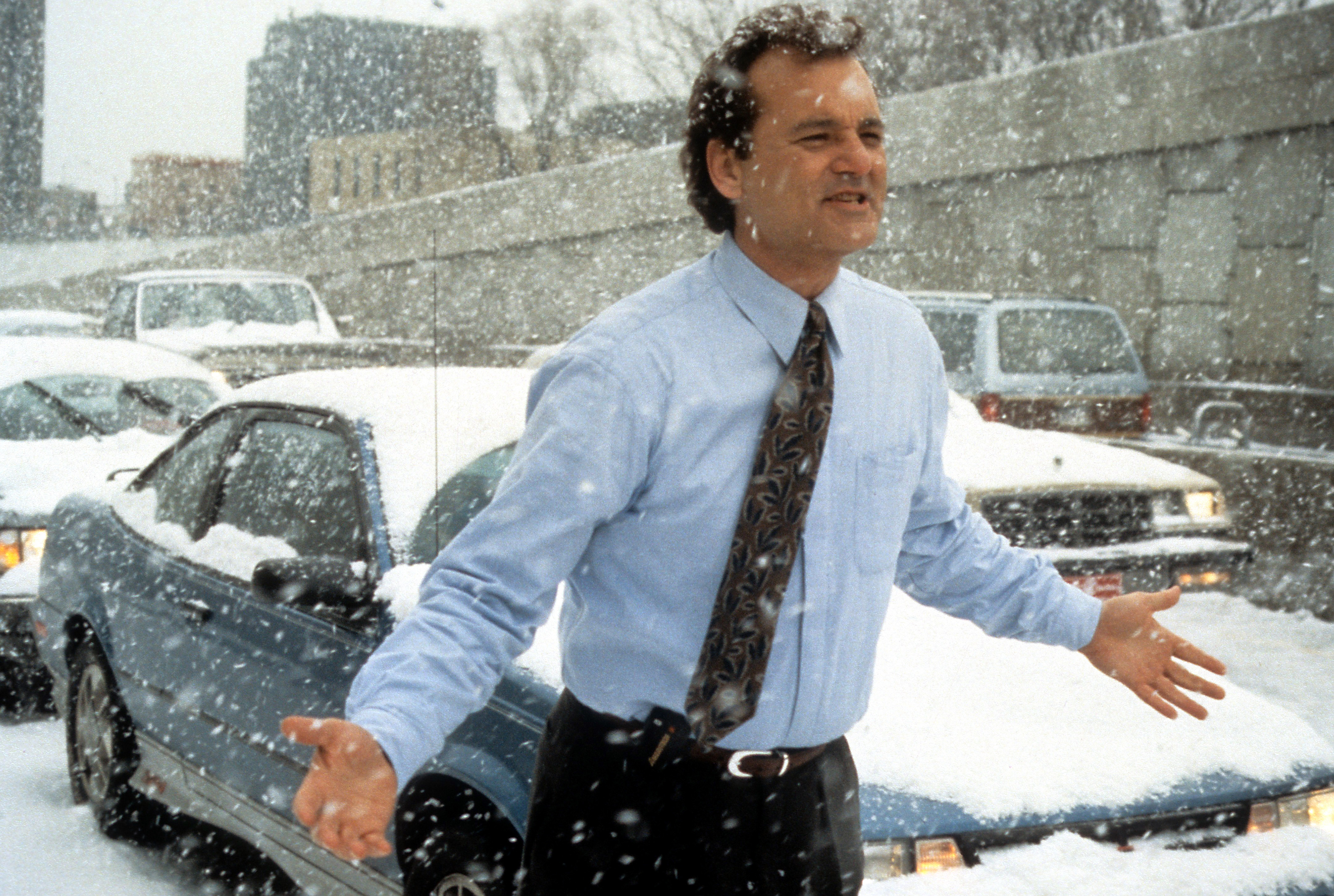 Bill Murray runs through the snow in a scene from the film 'Groundhog Day', 1993 | Source: Getty Images