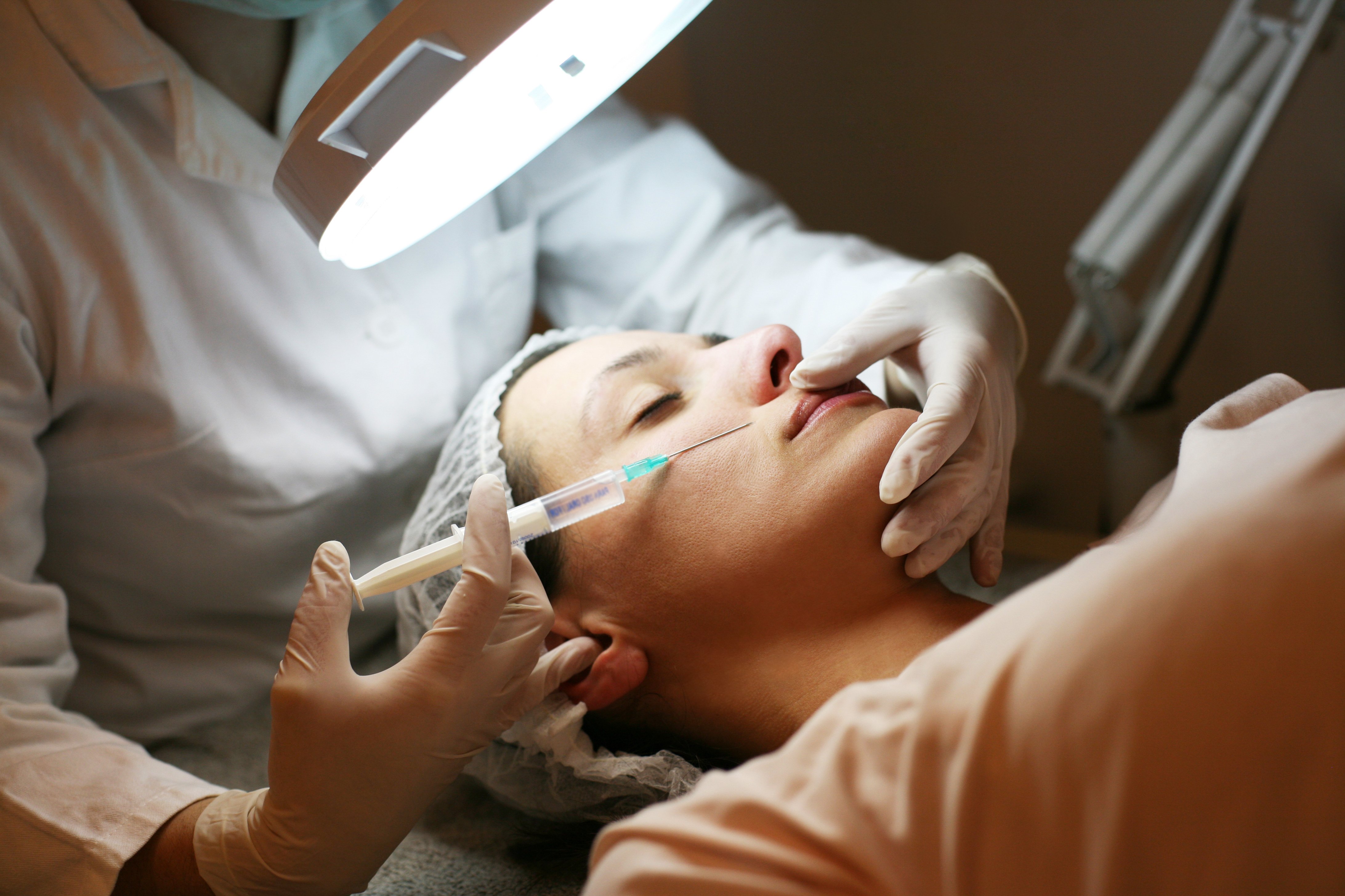A woman getting a facial procedure | Photo: Shutterstock