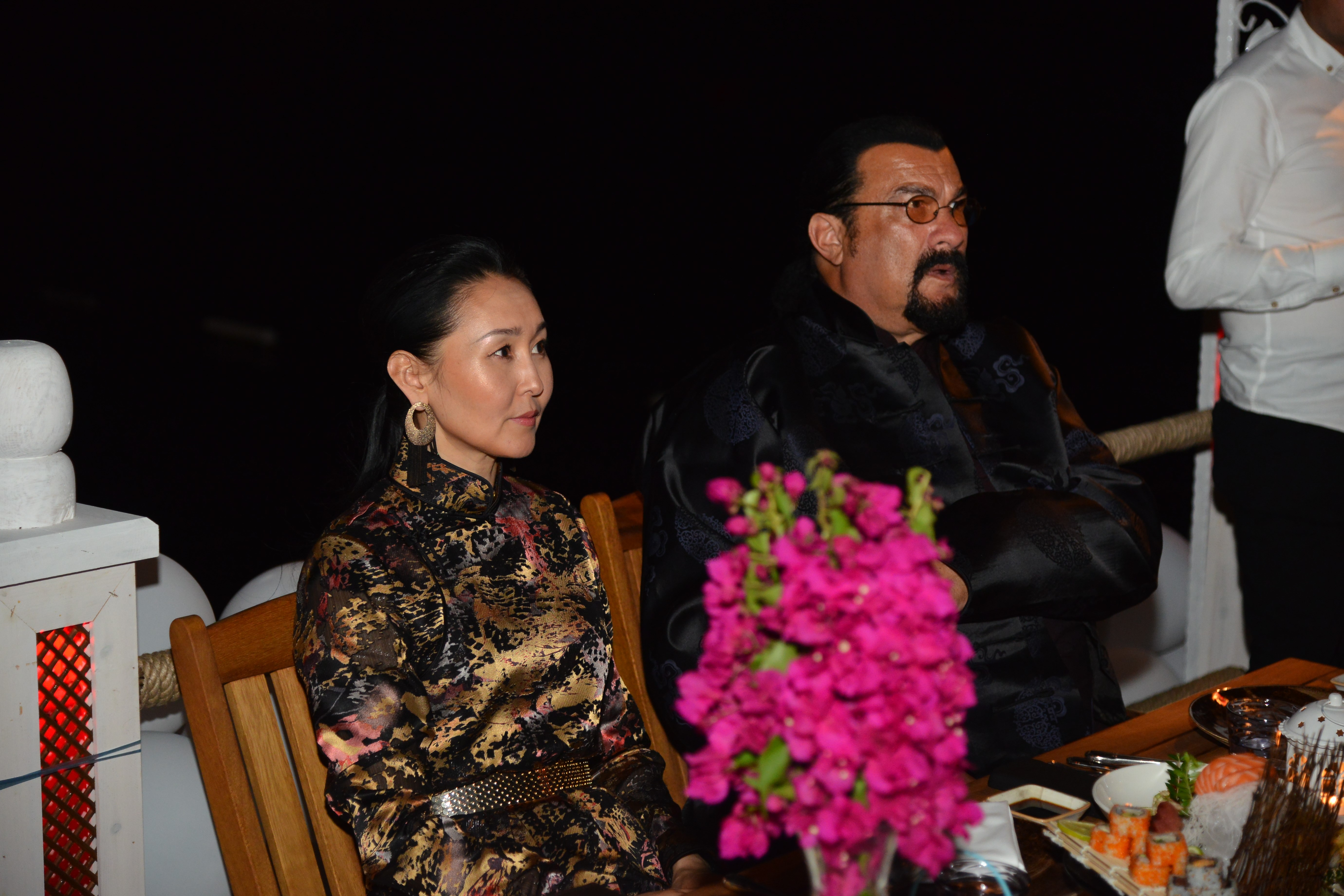 Steven Seagal and Erdenetuya Seagal attend a dinner following arrival on an invitation from Turkish American Business Association - American Chamber of Commerce in Turkey (TABA-AmCHam) on June 30, 2019, in the Bodrum district of Mugla, Turkey. | Source: Getty Images