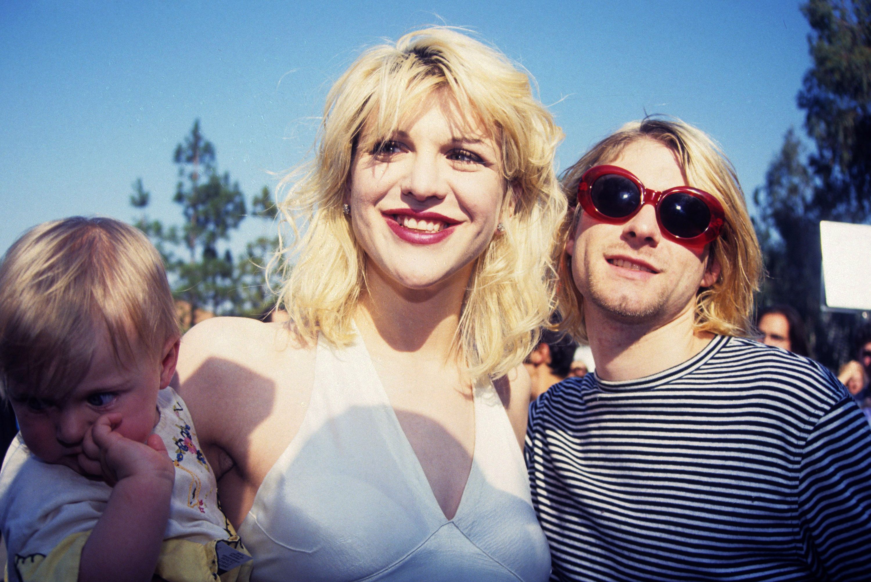 Kurt Cobain with wife Courtney Love and daughter Frances Bean Cobain at the 10th Annual MTV Video Music Awards. | Source: Getty Images