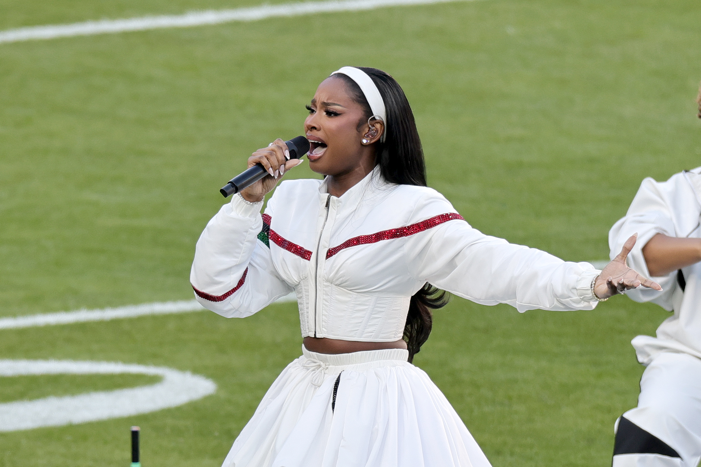 Coco Jones performing with range and emotion at the Super Bowl LX. | Source: Getty Images