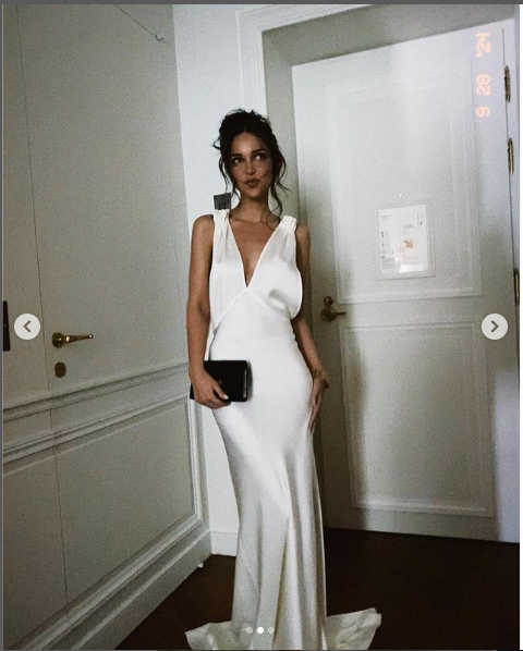 Jackie Apostel in a white gown she wore at Victoria Beckham's fashion show, posted on September 28, 2024 | Source: Instagram/jackie.apostel