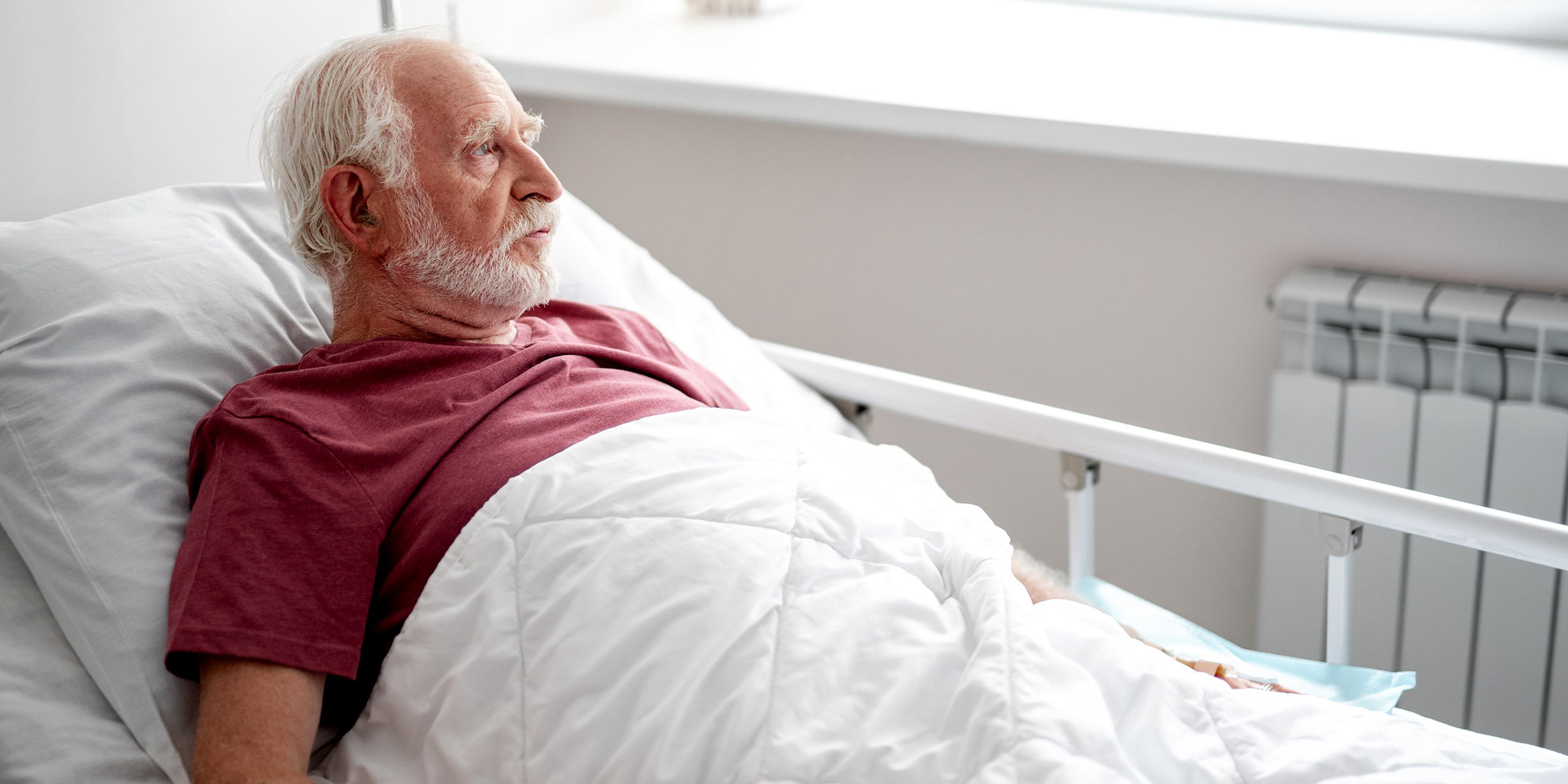 An old man at a hospital | Source: Shutterstock