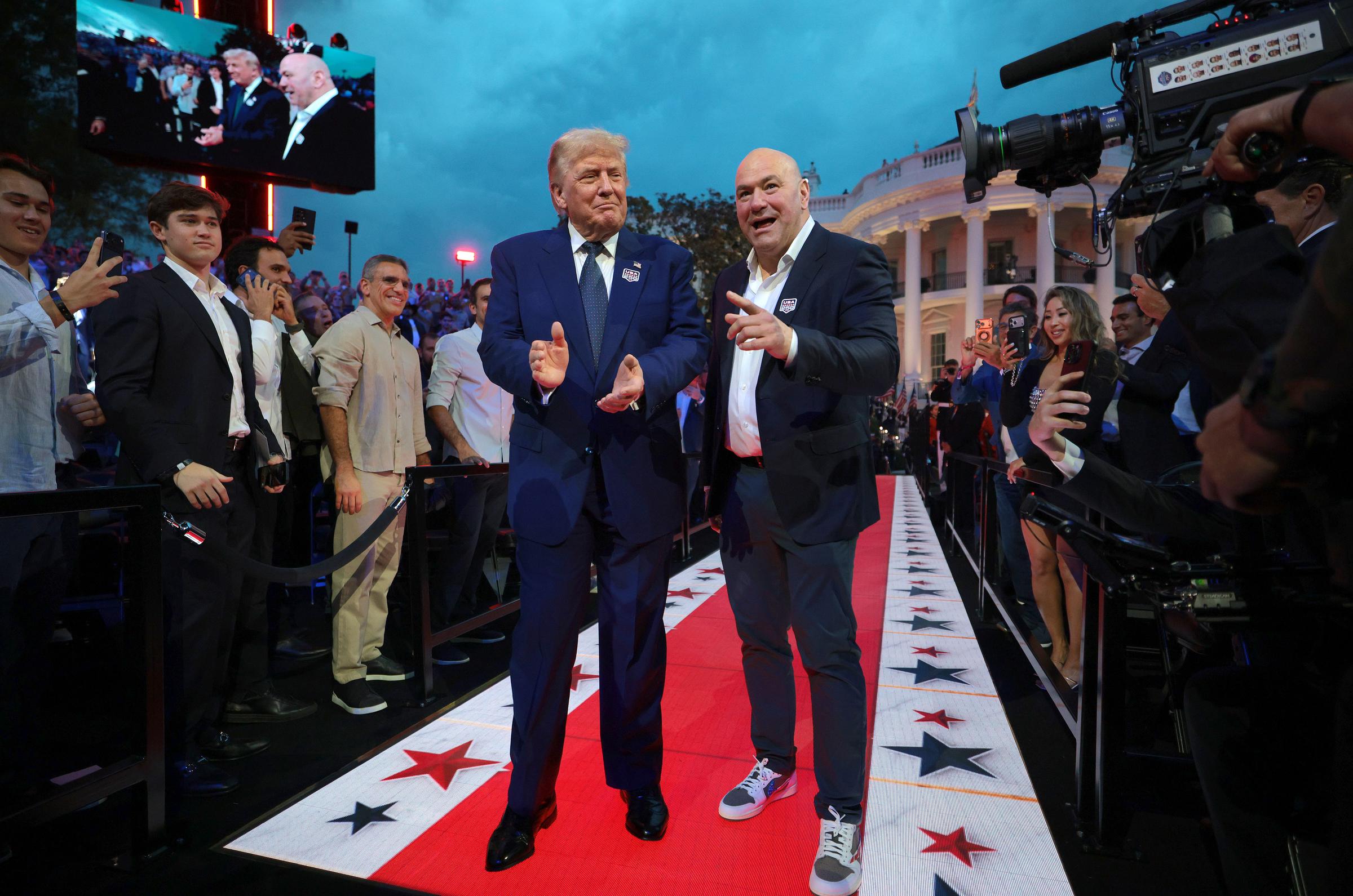 Donald Trump and Dana White make their entrance at UFC Freedom 250, one of the summer's most anticipated invitations in Washington. | Source: Getty Images