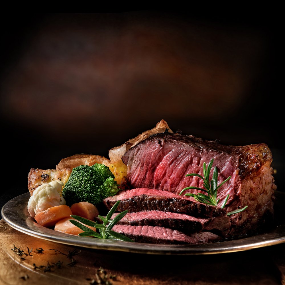 Rare roast beef meal with organic root vegetables with roasted potatoes. | Photo: Shutterstock.