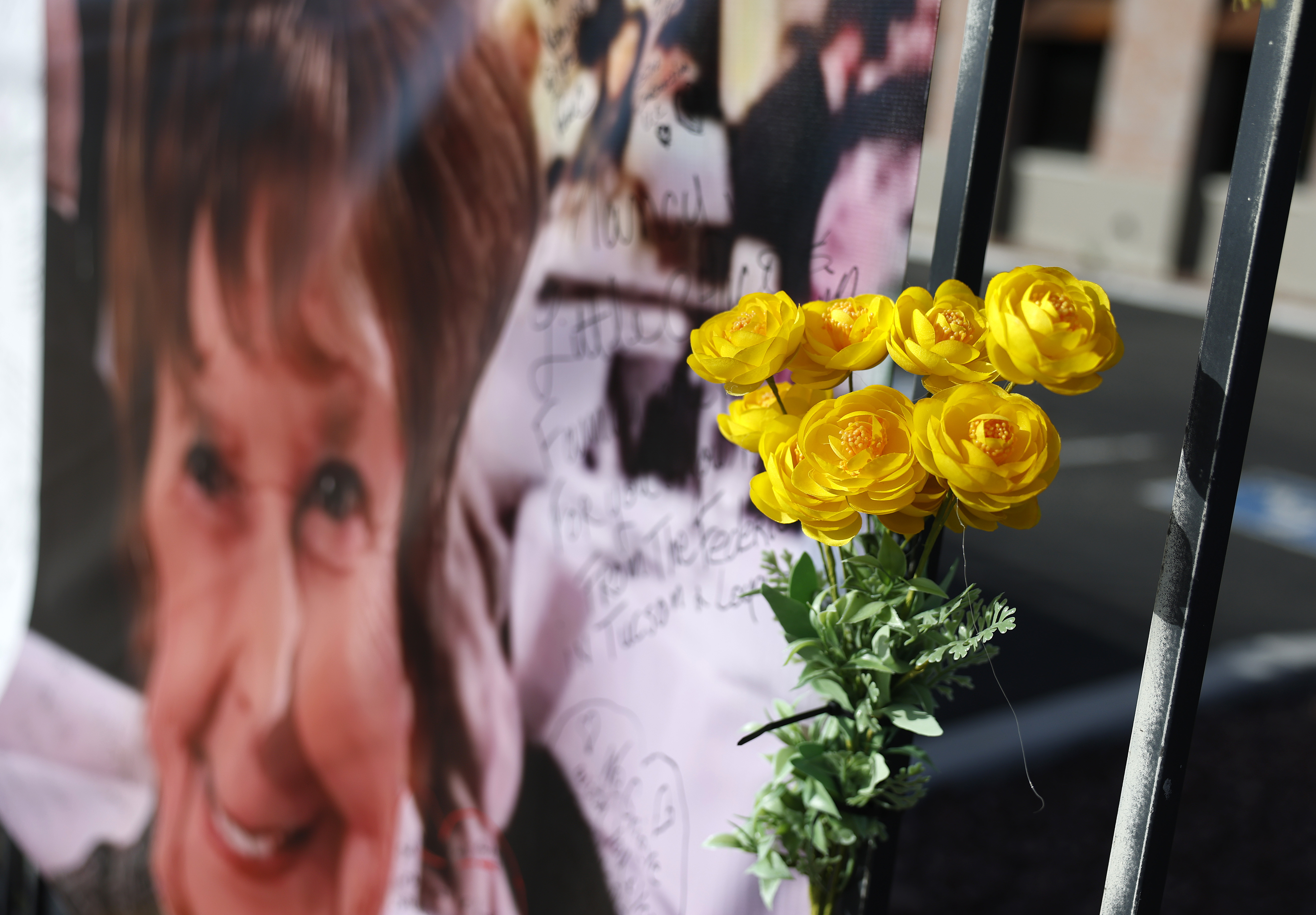 A photo of Nancy Guthrie is displayed with yellow flowers outside a Tucson news station on March 1, 2026, amid ongoing search efforts | Source: Getty Images