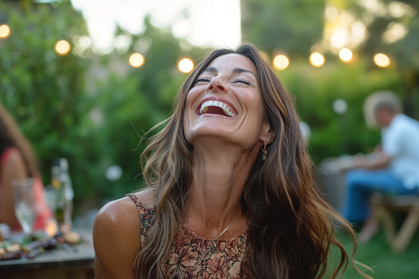 A woman laughing | Source: Midjourney