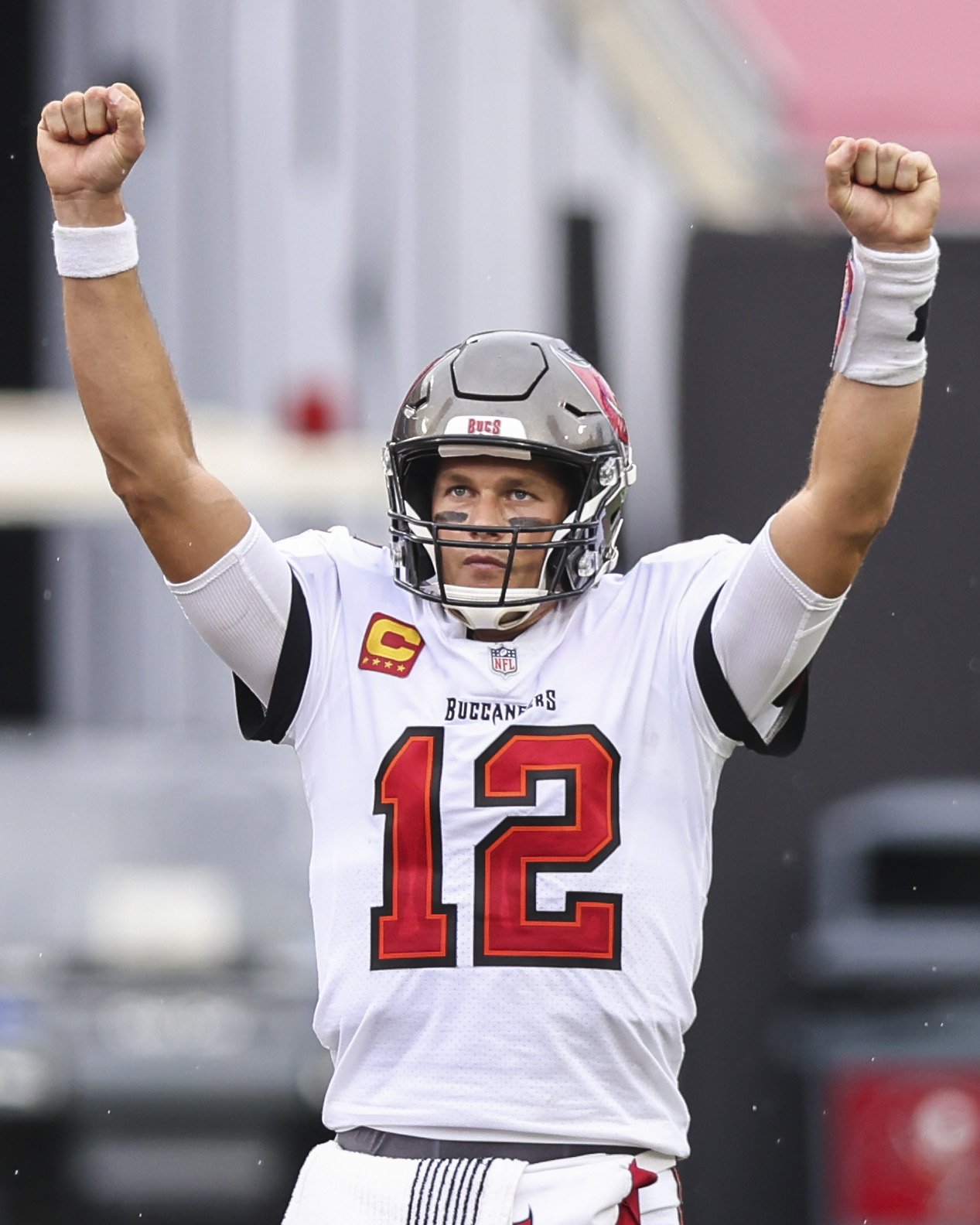 Tom Brady #12 of the Tampa Bay Buccaneers celebrates after defeating the Los Angeles Chargers after a game at Raymond James Stadium on October 04, 2020 in Tampa, Florida | Source: Getty Images 