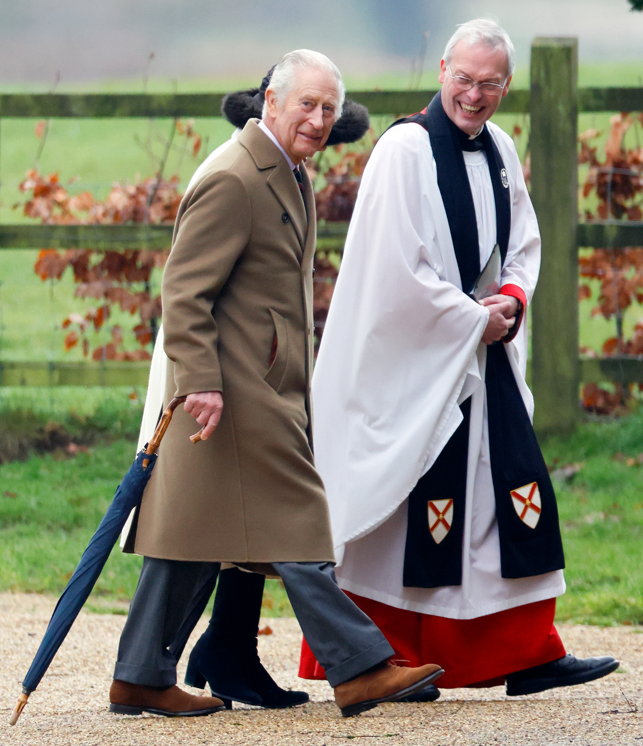 King Charles III and Queen Camilla, accompanied by The Reverend Canon Dr. Paul Williams, at the Sunday service at the Church of St. Mary Magdalene on the Sandringham estate on February 11, 2024 | Source: Getty Images