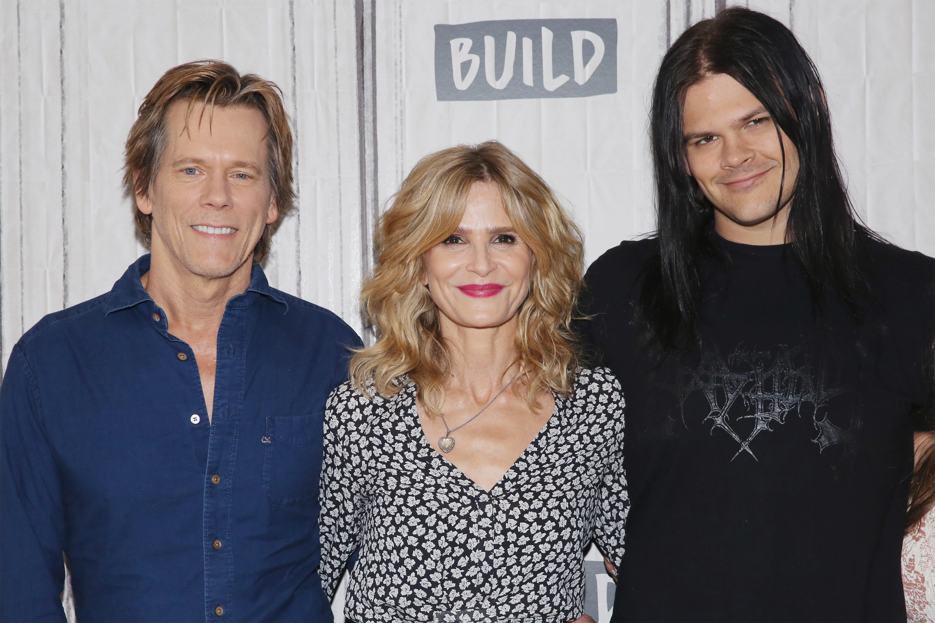 Kevin Bacon, Kyra Sedgwick, and Travis Bacon visit Build to discuss the film "Story of a Girl" on July 21, 2017, in New York City | Source: Getty Images