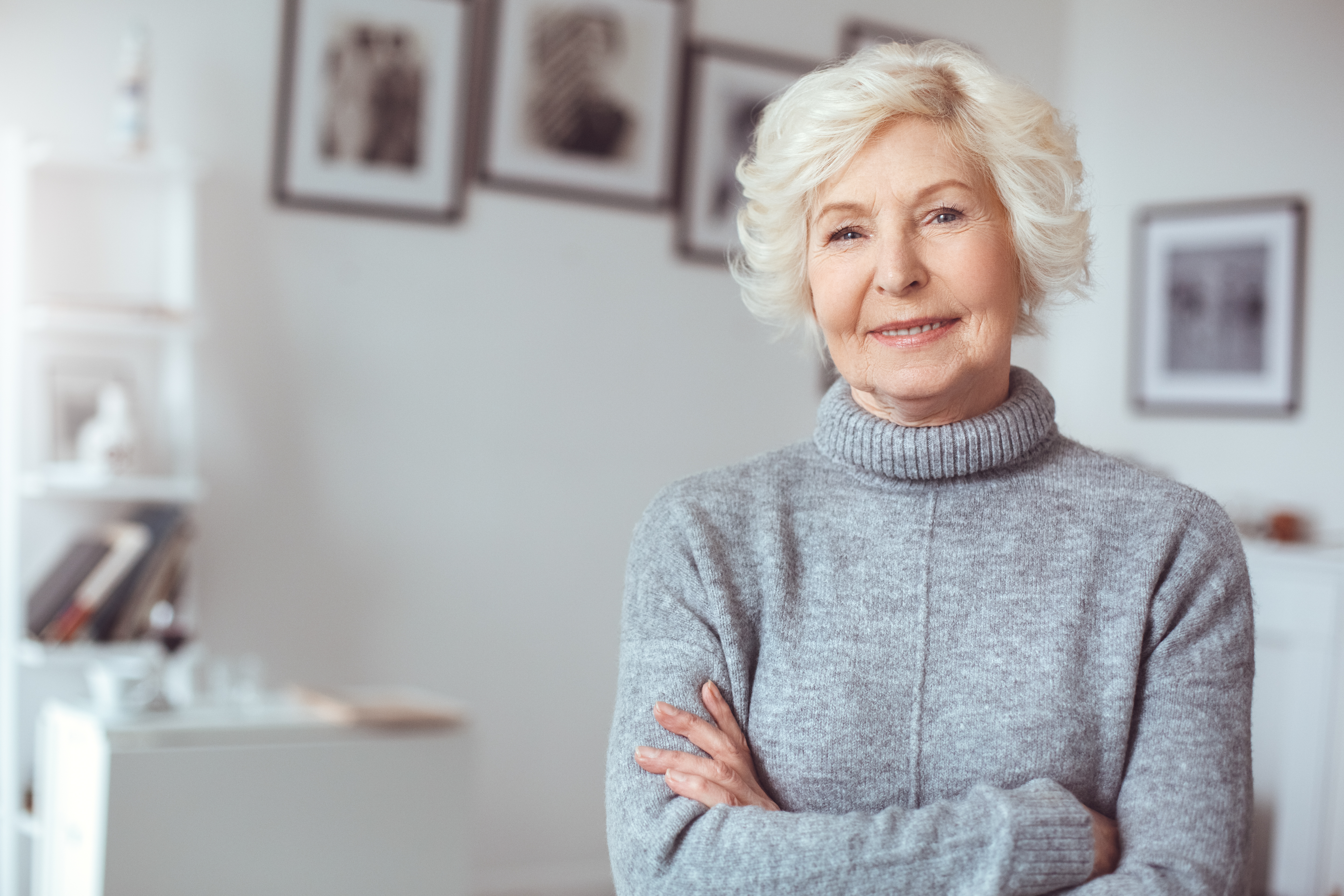 An older woman standing with her arms folded | Source: Shutterstock