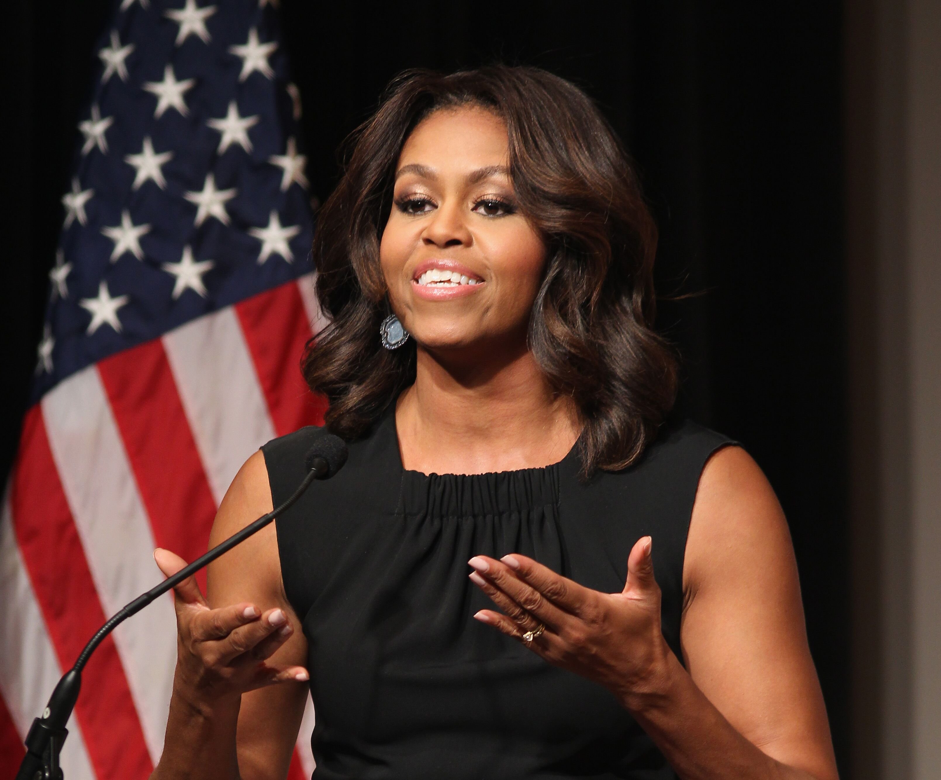 The former First Lady of the United States Michelle Obama speaks on stage at the Women Veterans Career Development Forum at Women in Military Service for America Memorial on November 10, 2014 | Photo: Getty Images