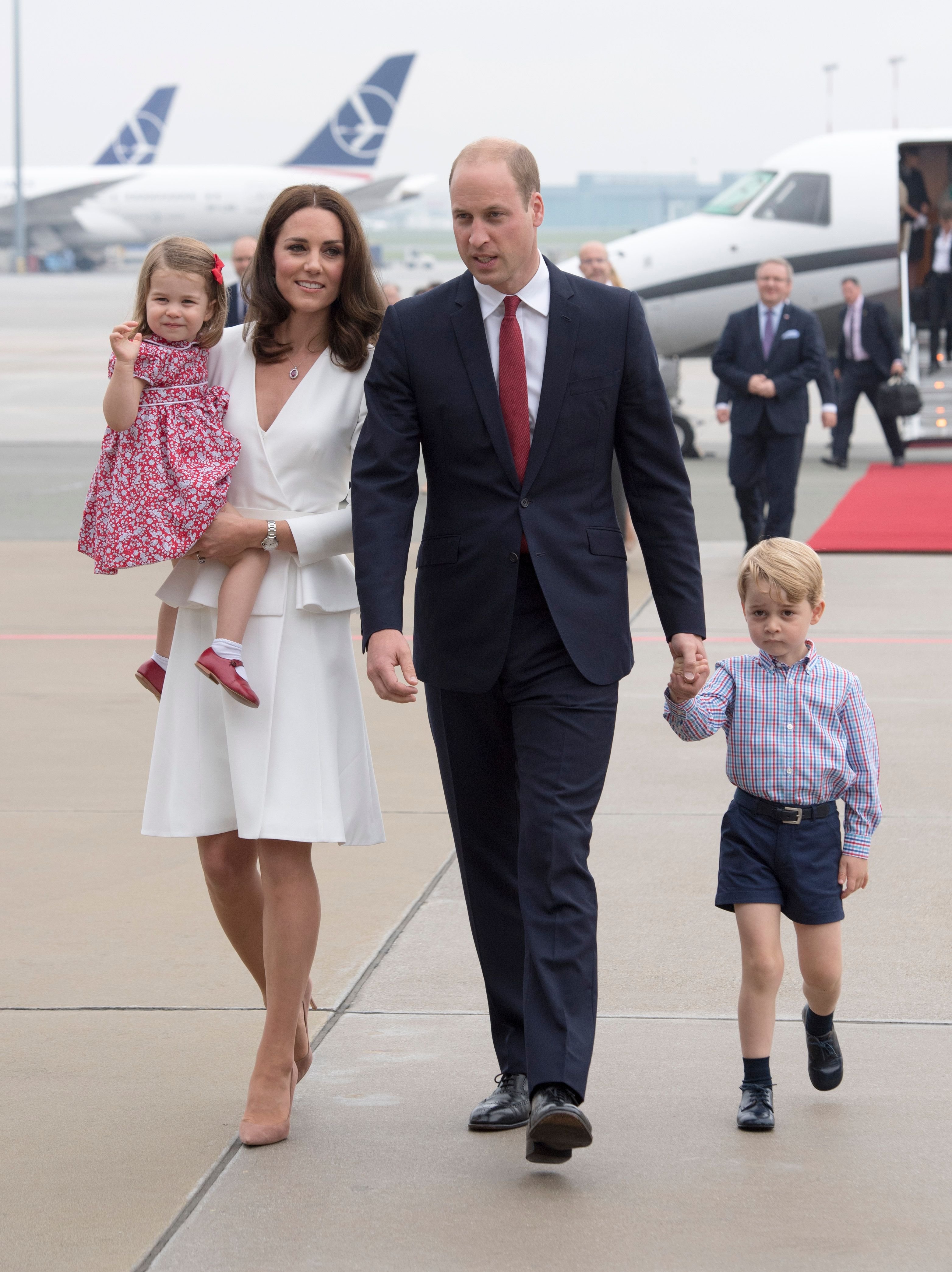 Prince William, Kate Middleton with their children Prince George and Princess Charlotte arrive at Warsaw airport to start a 3 day tour on July 17, 2017 in Warsaw, Poland | Photo: Getty Images
